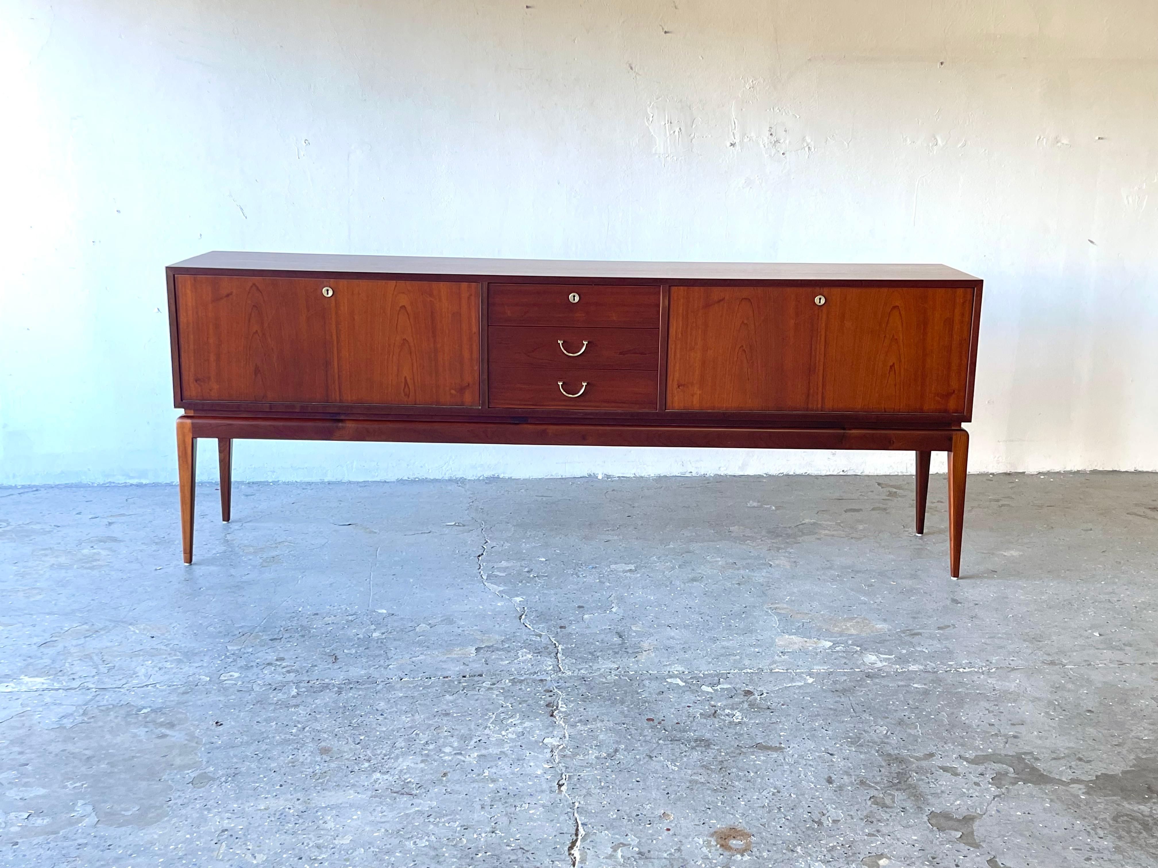 Elegant Extra long Mid-Century Modern Walnut credenza

Very elegant and long credenza Just breath taking.. One of the nicest we have had in the last 20 years of selling. Very possibly Italian. 

84 inches wide 17 inches deep and 32.5 high
Drawer 17