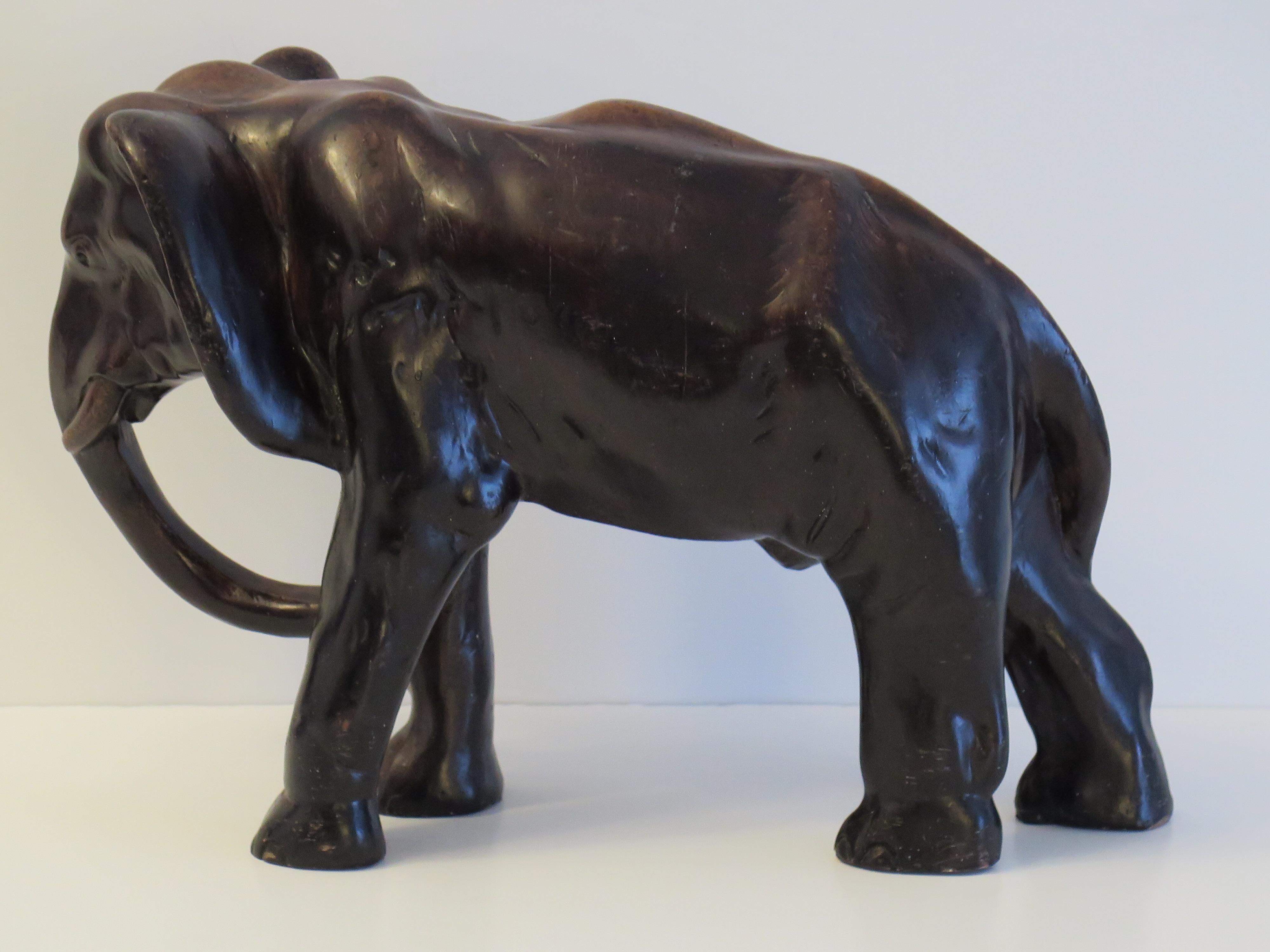 This is a large stone sculpture of an elephant, made from a cast or composite stone all hand painted and signed. We date this piece to the early 20th Century , Circa 1920.

This piece has been very well hand made with good authentic detail.
This is