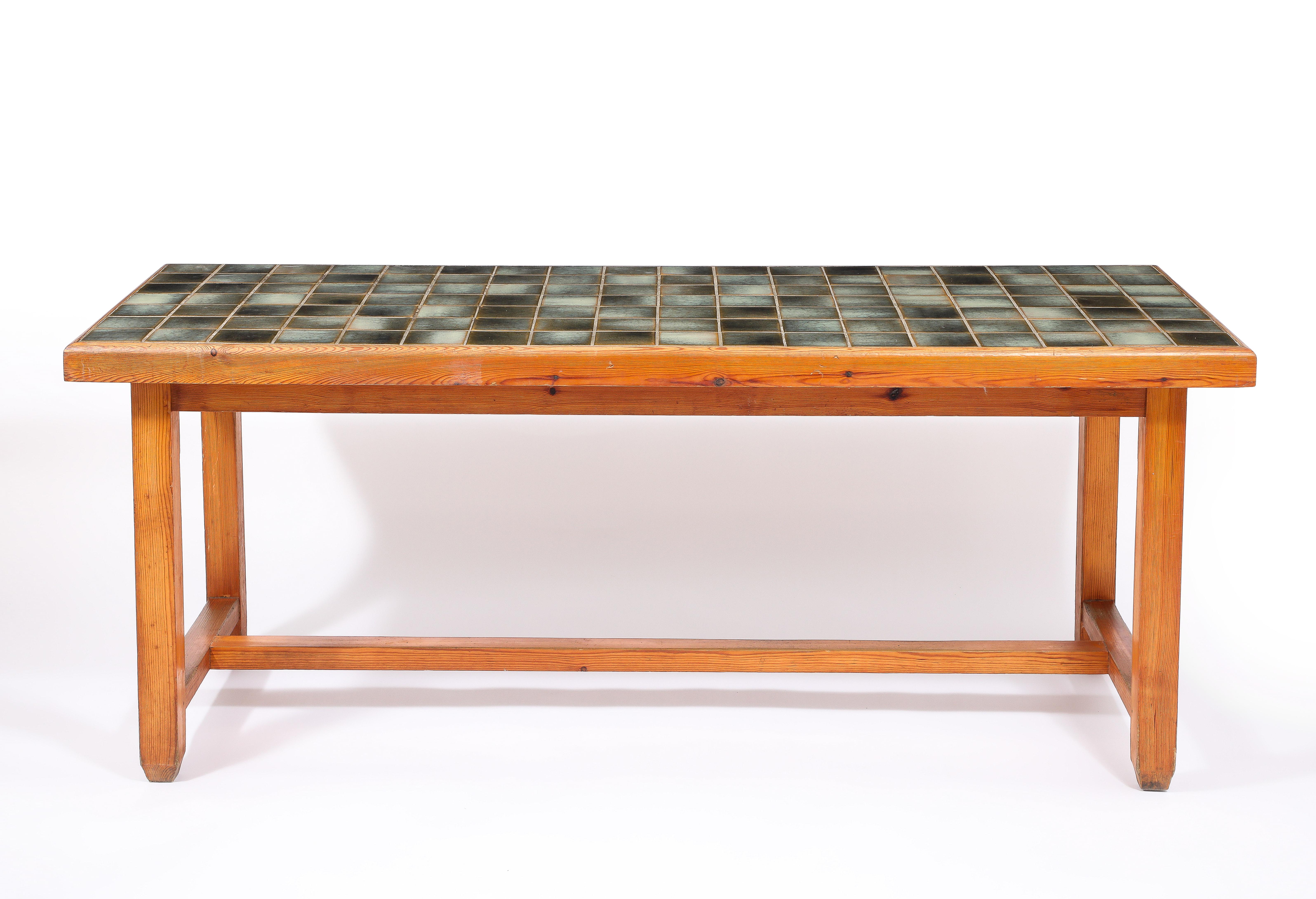 Large Elm table with a tile top attributed to Colette Gueden.