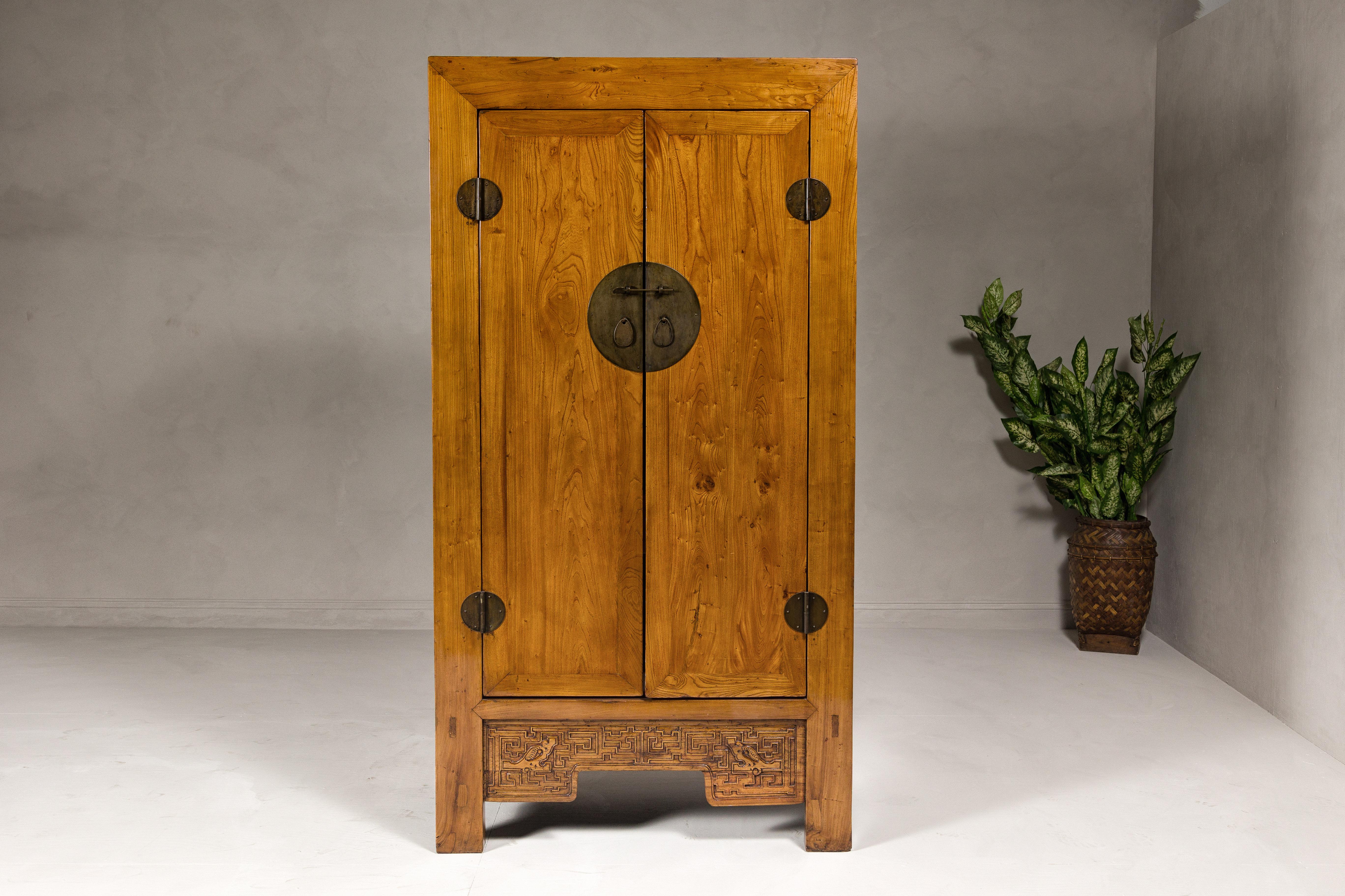 Chinese Large Elmwood 19th Cabinet with Carved Apron and Round Brass Medallion For Sale