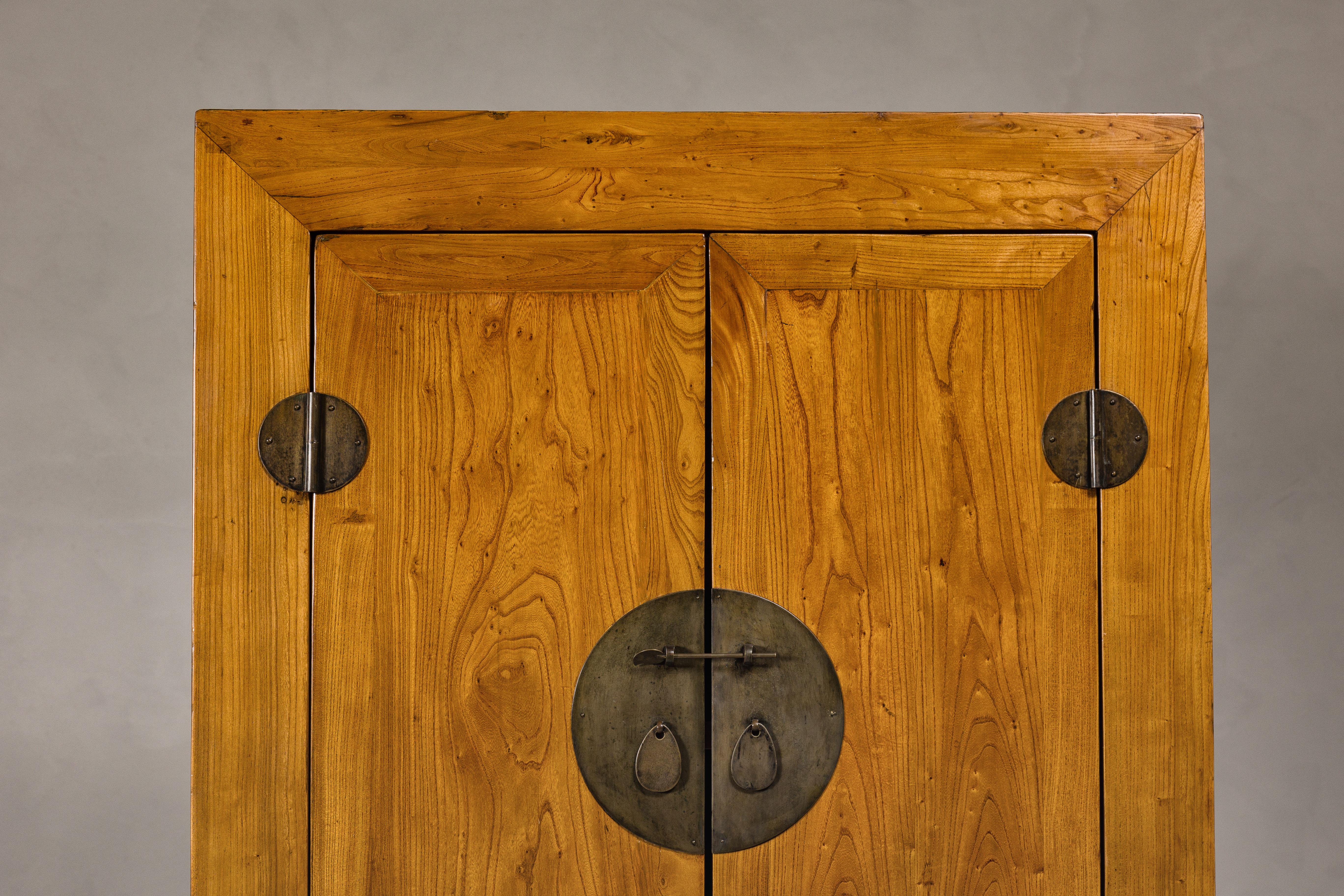 Large Elmwood 19th Cabinet with Carved Apron and Round Brass Medallion In Good Condition For Sale In Yonkers, NY