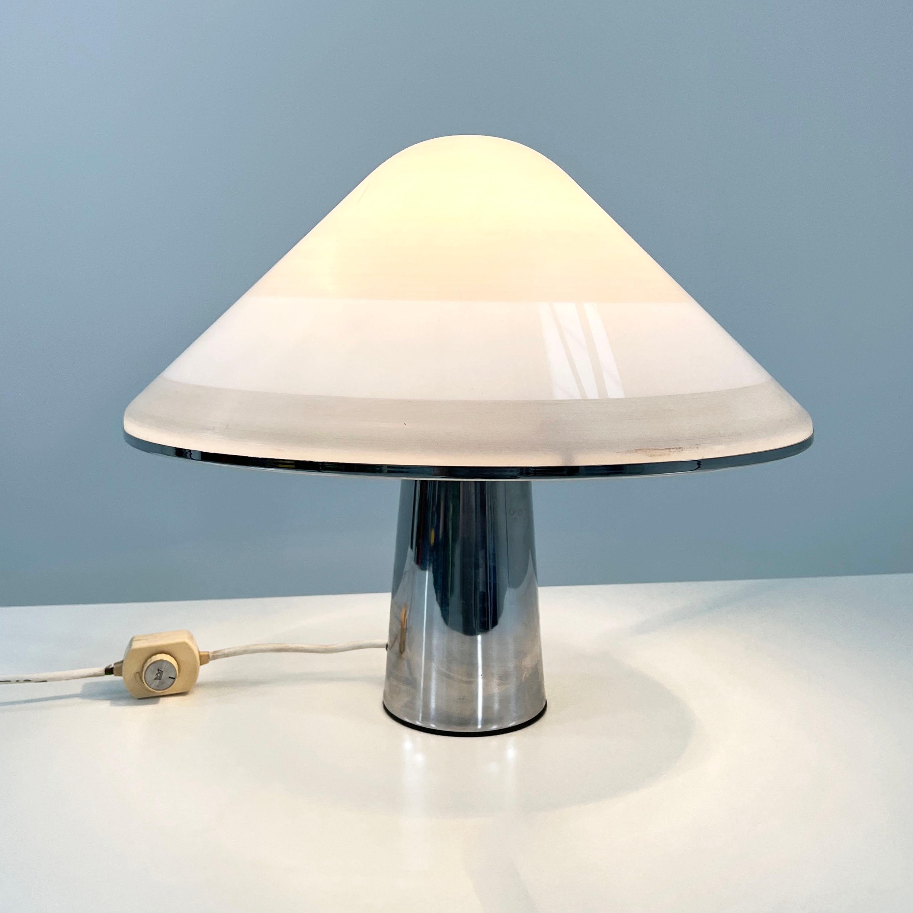 Producer - iGuzzini
Model - Elpis Table Lamp 
Design Period - Seventies
Measurements - Width 50 cm x Depth 50 cm x Height 40 cm 
Materials - Perspex plastic, chrome plating, metal 
Color - White, Silver
Light wear consistent with age and use.