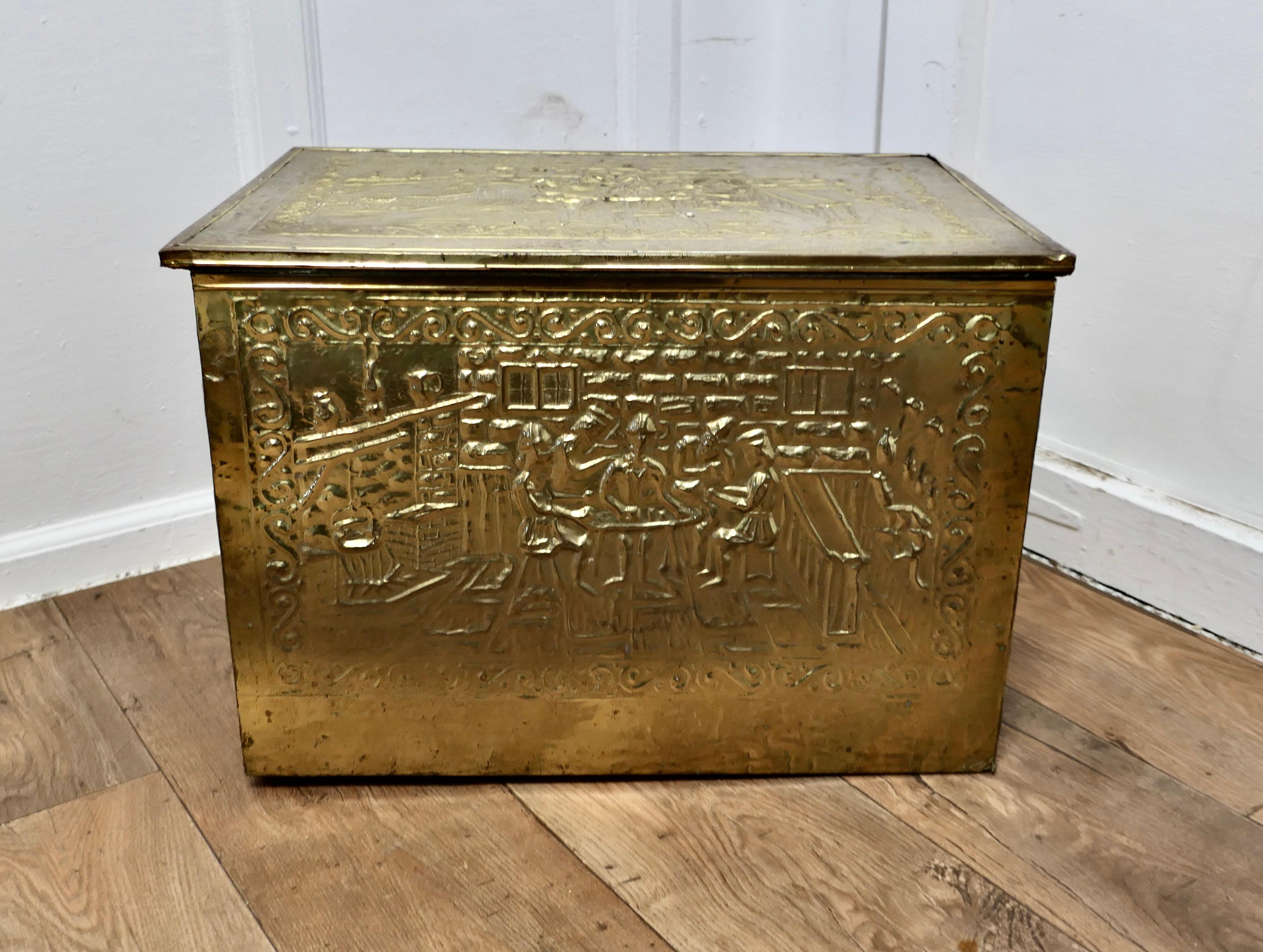 Large Embossed Brass Log Box, with Tavern Scenes 

This is a delightful large chest is made in Brass with a soft lining, the beaten brass is embossed with Tavern scenes
This is an old piece it has a very good colour, it is in good condition for its