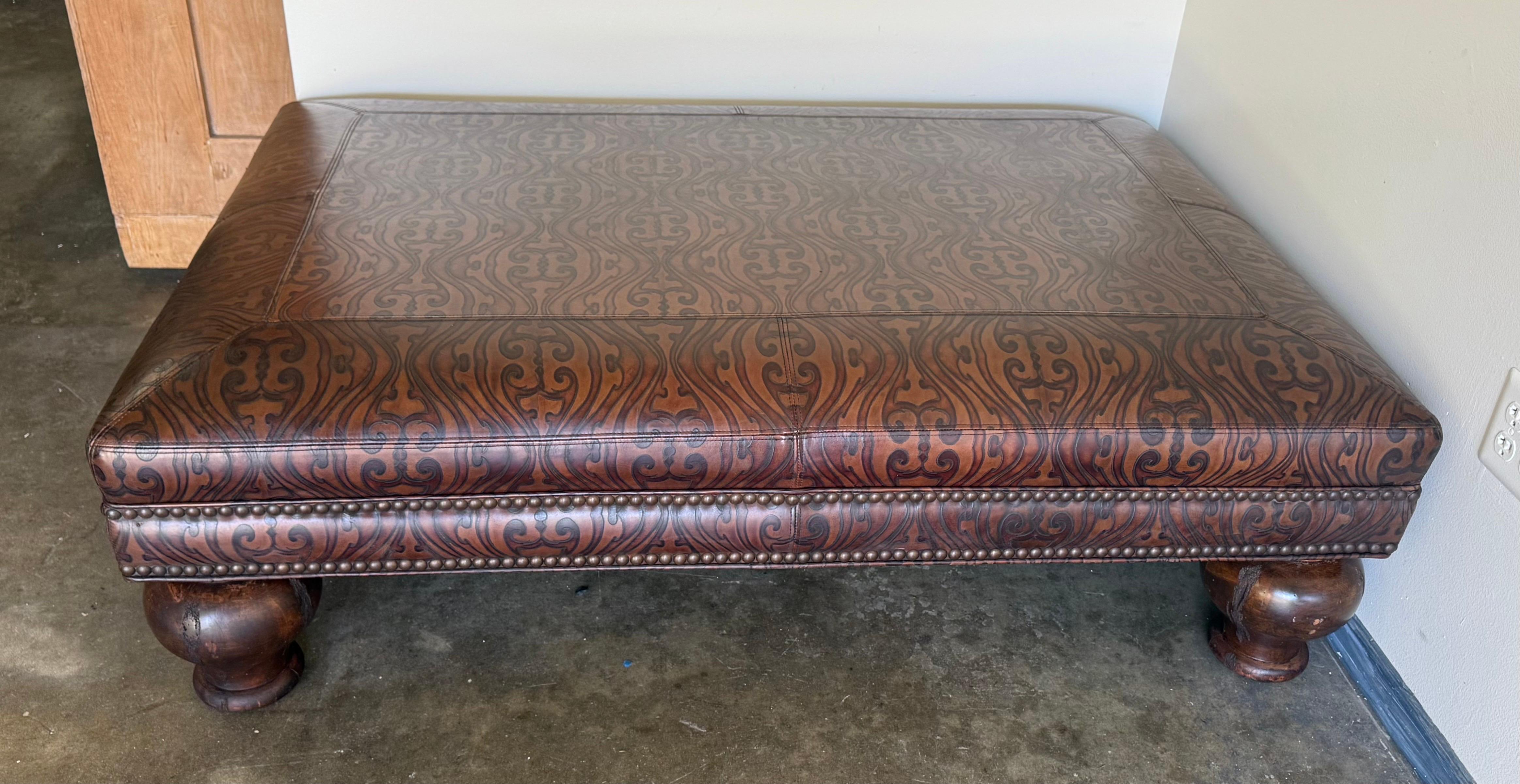Spanish Colonial Large Embossed Leather Ottoman with Bun Feet For Sale