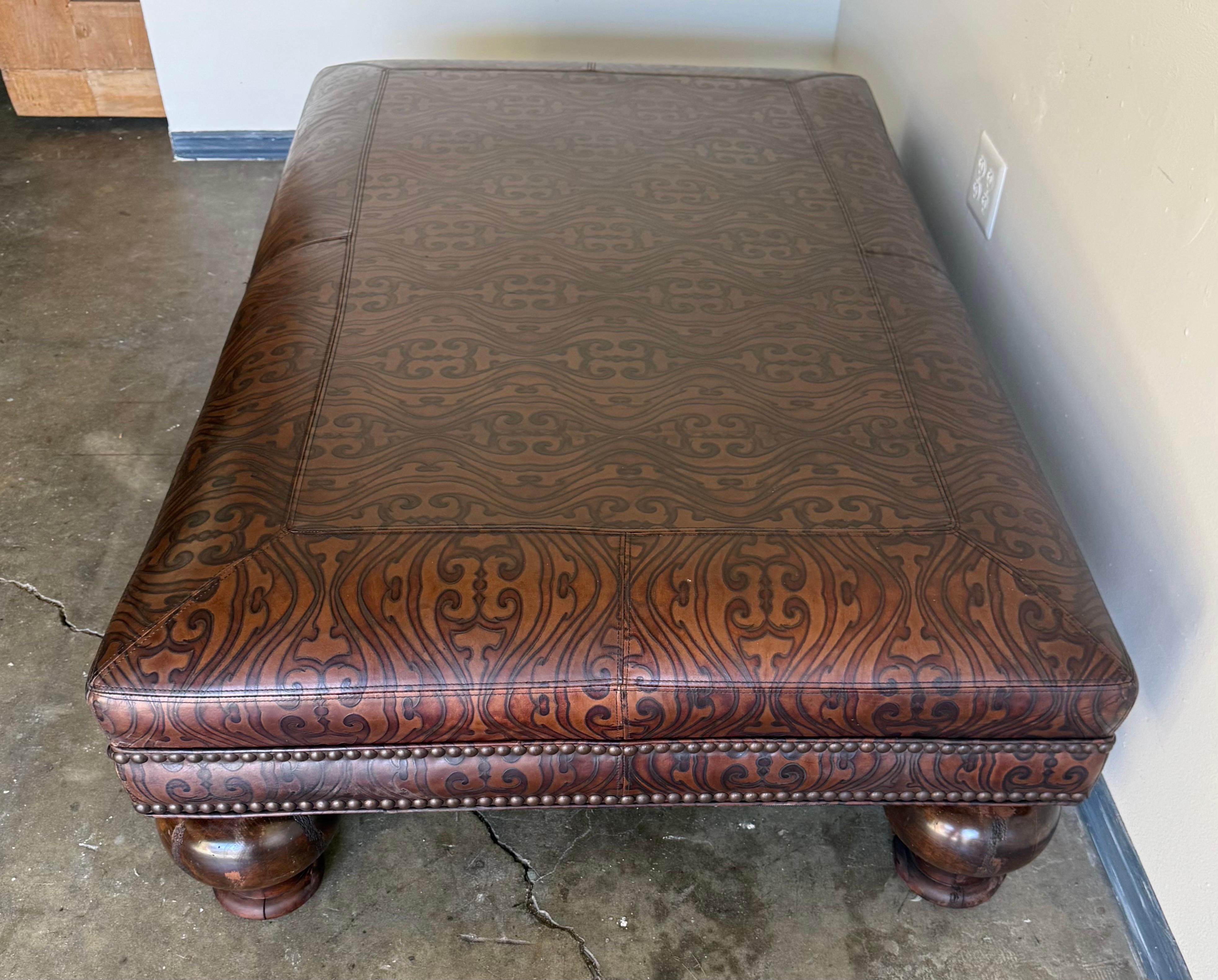 Large Embossed Leather Ottoman with Bun Feet In Good Condition For Sale In Los Angeles, CA