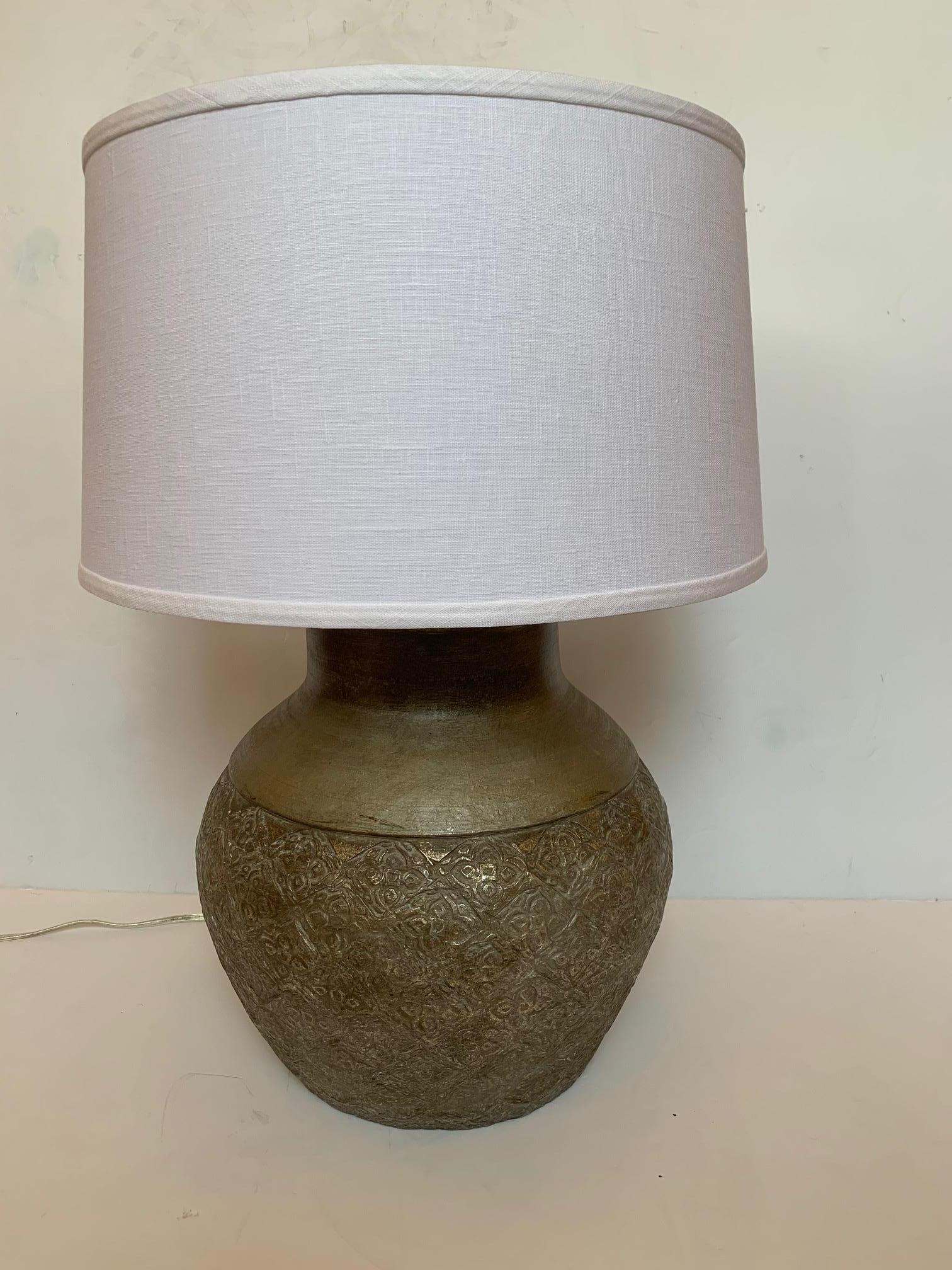 Great looking large neutral vintage table lamp having embossed metal round base and new canvas shade.
Base is 16
