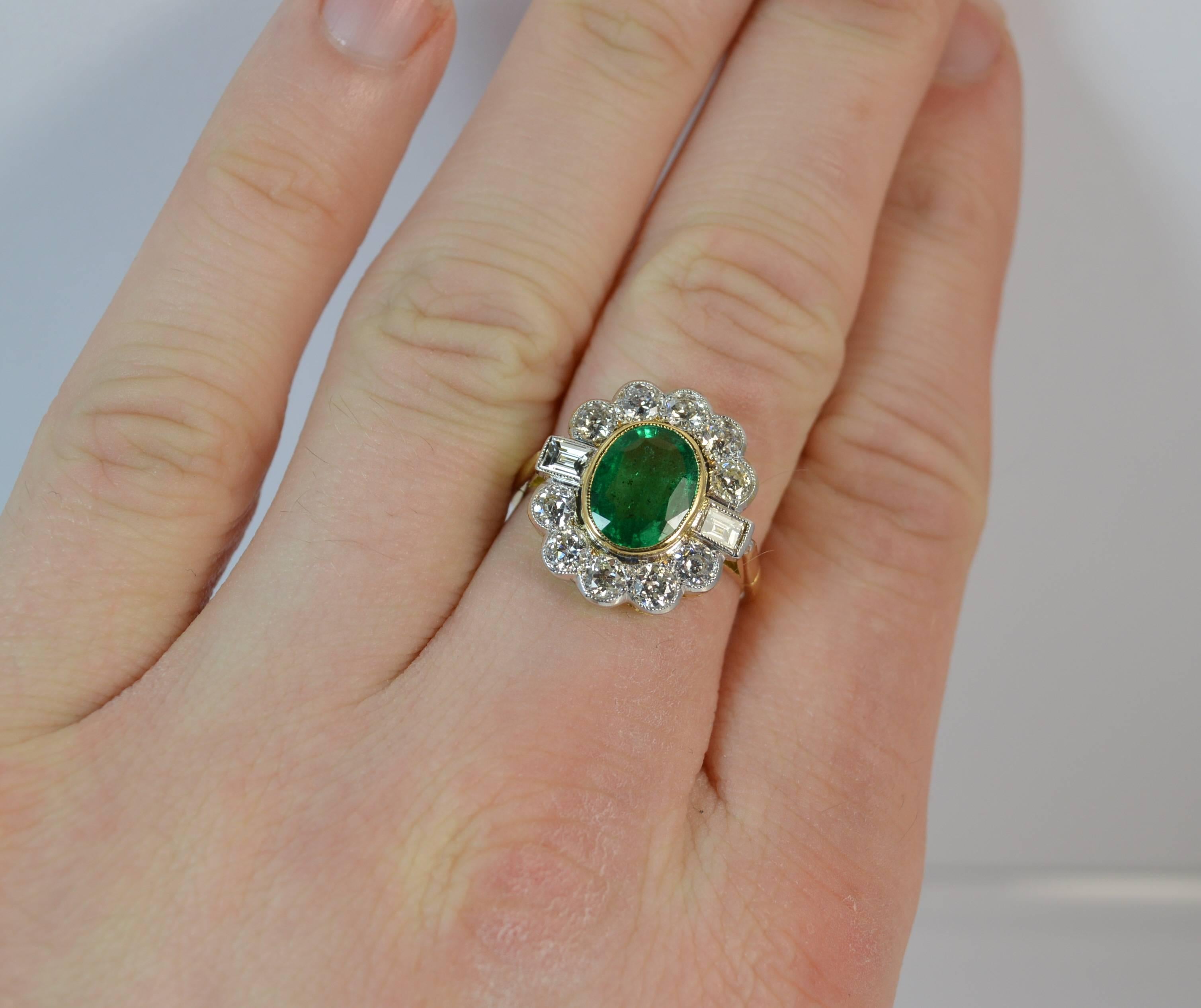 An absolutely fantastic Emerald and Diamond cluster or cocktail ring.

​Designed with a beautiful oval cut natural emerald to the centre, 7.5mm x 9.5mm approx. Surrounding are five natural old cut and two emerald cut diamonds to create a striking