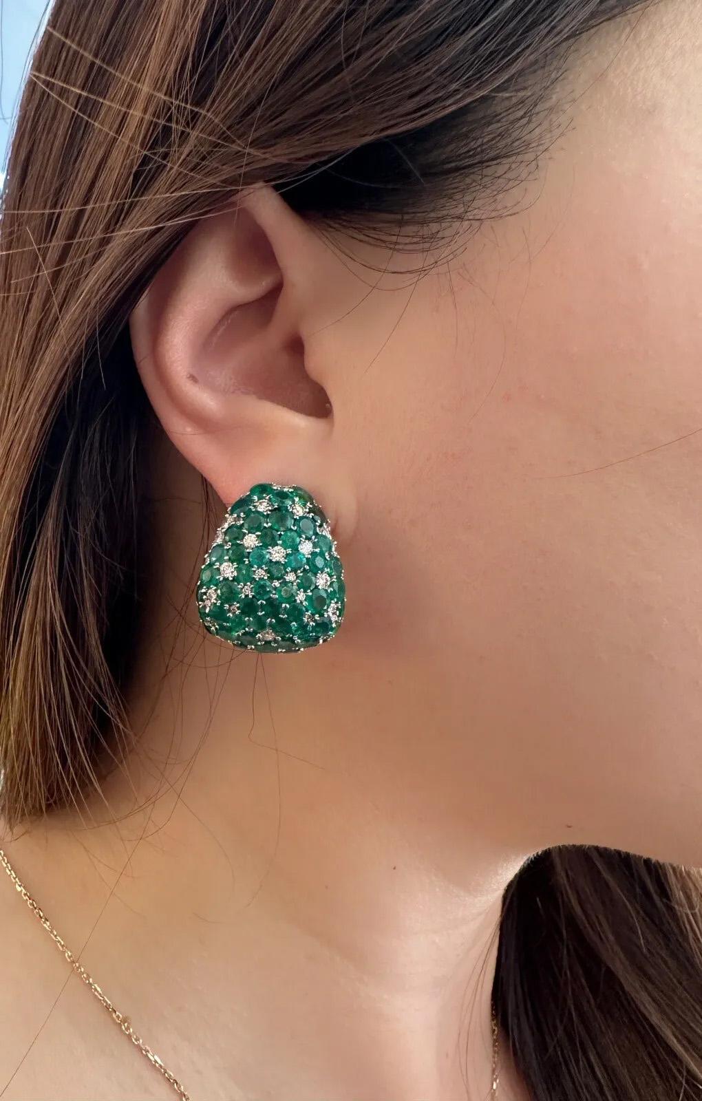 Large Emerald and Diamond Half-hoop Earrings 
in 18k White Gold 

Emerald and Diamond Earrings features a triangular half-hoop design with Natural Round Emeralds weighing 16.52 carats, pave set with Round Brilliant Diamonds weighing 2.31 carats, set