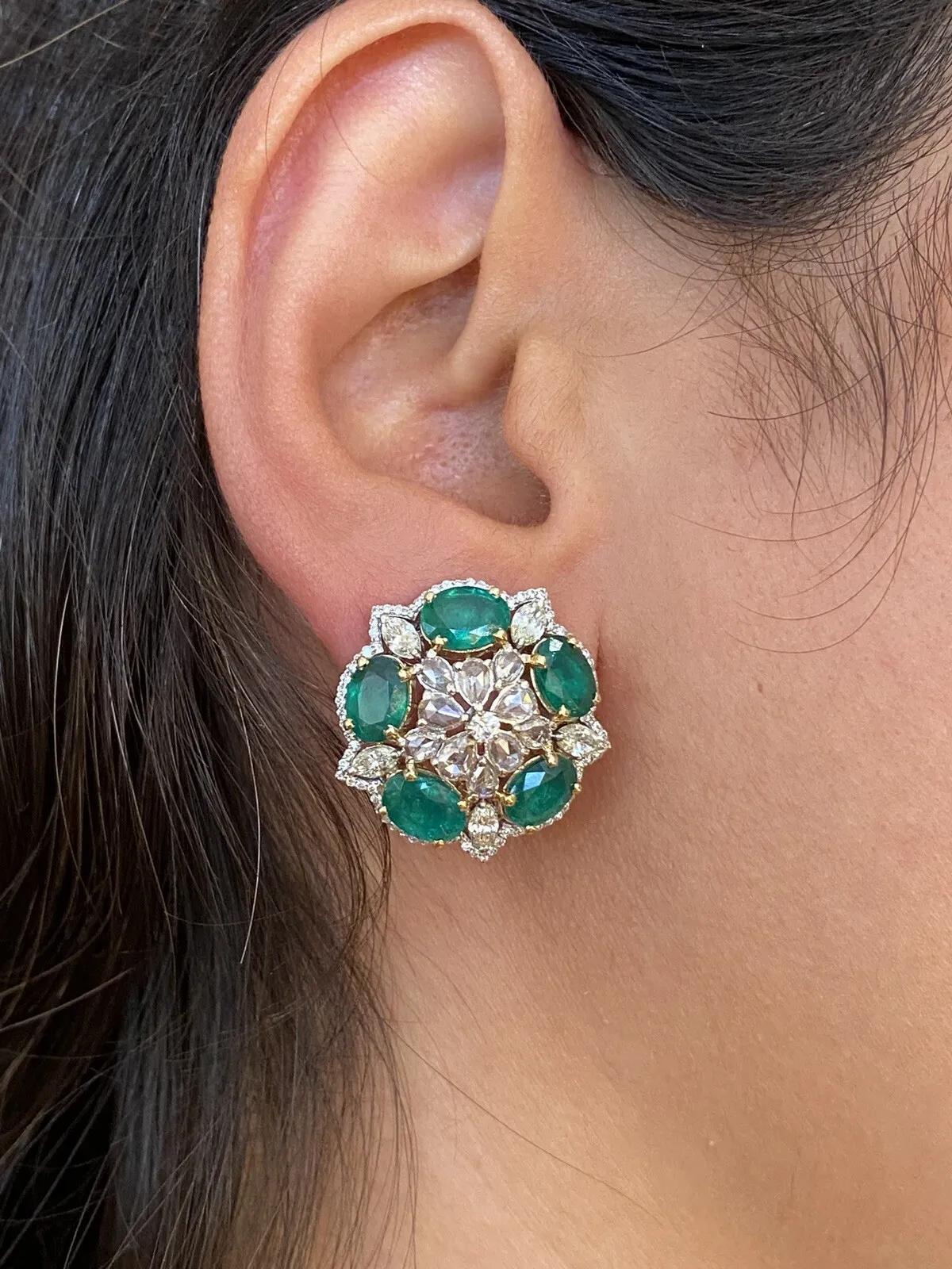 Large Emerald and Diamond Star Design Earrings in 18k White Gold

Emerald and Diamond Earrings features 5 deep green Oval Emeralds in each earring set in circle with Round Brilliants, Marquise and Rose Cut Diamonds set throughout in star pattern in