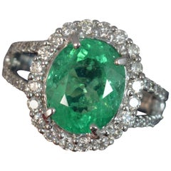 Large Emerald and Vs 1.00 Carat Diamond 18 Carat White Gold Cluster Ring