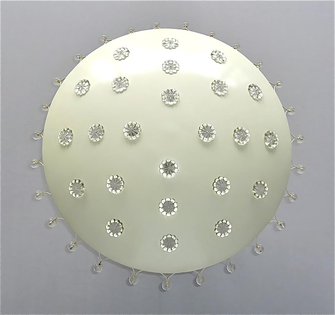 Large beautiful starburst ceiling light or flush mount flower chandelier in off- white enameled metal with patinated brass canopy, round crystal glass flower applications and glass pearls, designed by Emil Stejnar and executed by Rupert Nikoll,