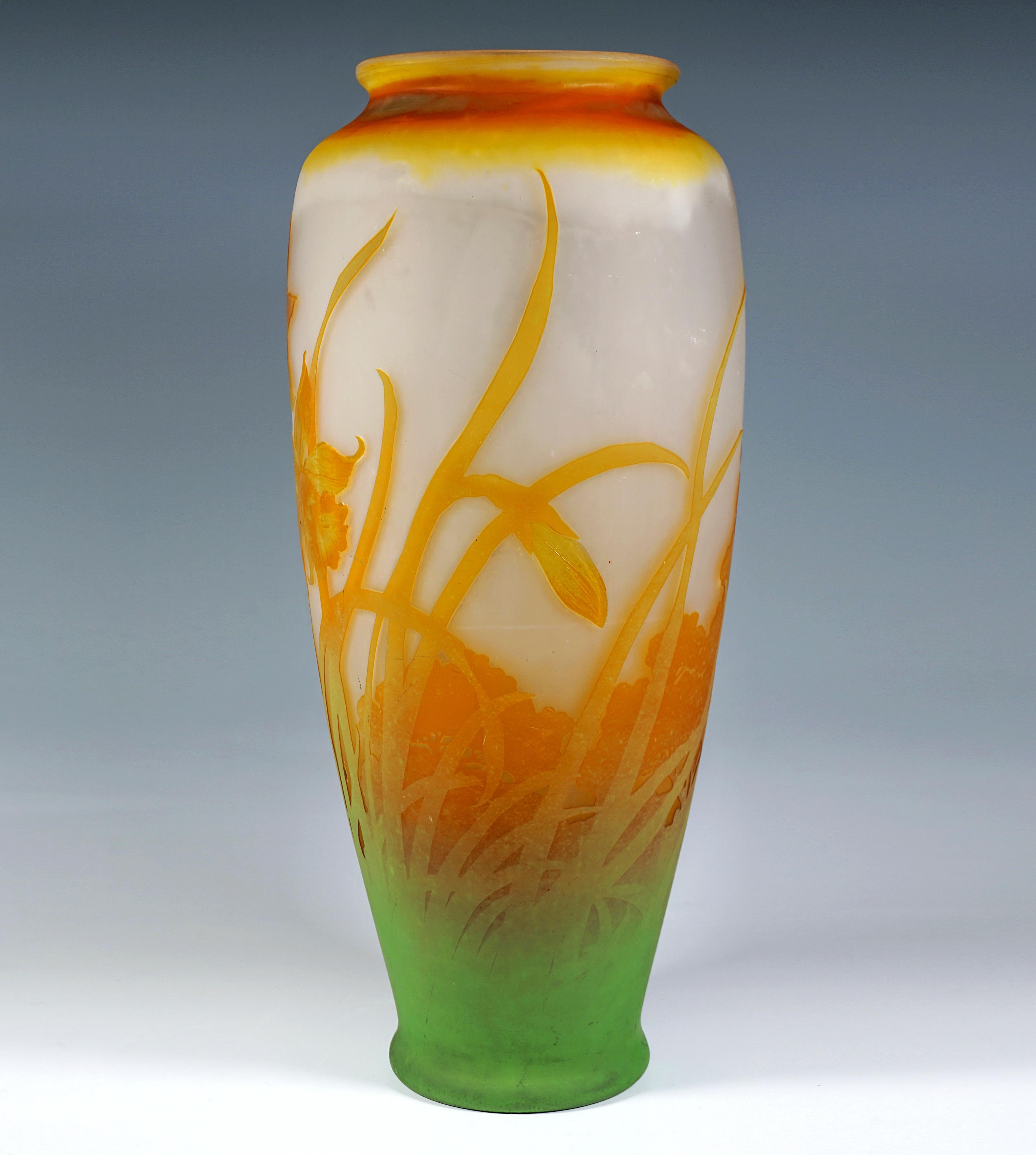 Baluster-shaped vase body on a slightly flared, flush base with a bulbous, upwardly widening wall, on gently sloping shoulders a constriction to form a short neck piece with a slightly flared rim, colourless glass with flaky white, yellow and