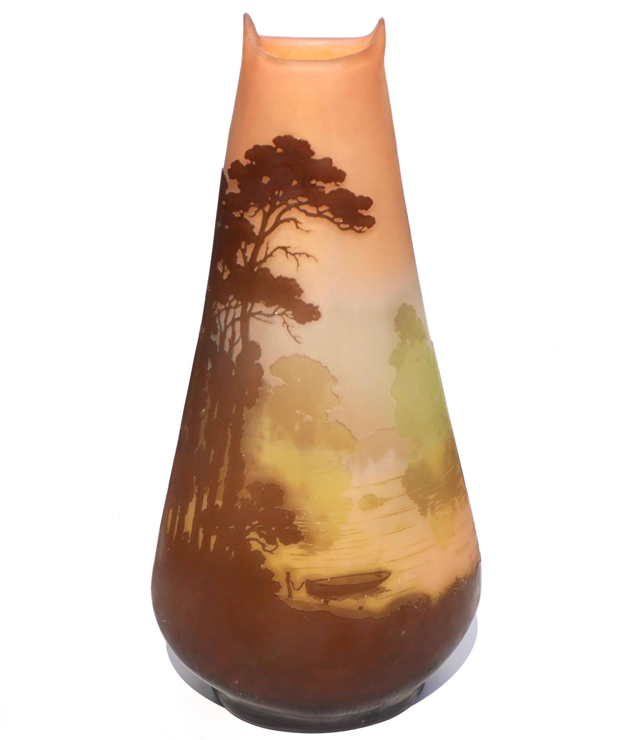 Emile Galle scenic wheel carved and acid etched cameo vase.

A beautiful and tall cameo vase by Galle. The 18 - 1/2” tall vase has a background of muted yellow glass near the base, which progresses to blue/gray at mid-vase, and then peach towards