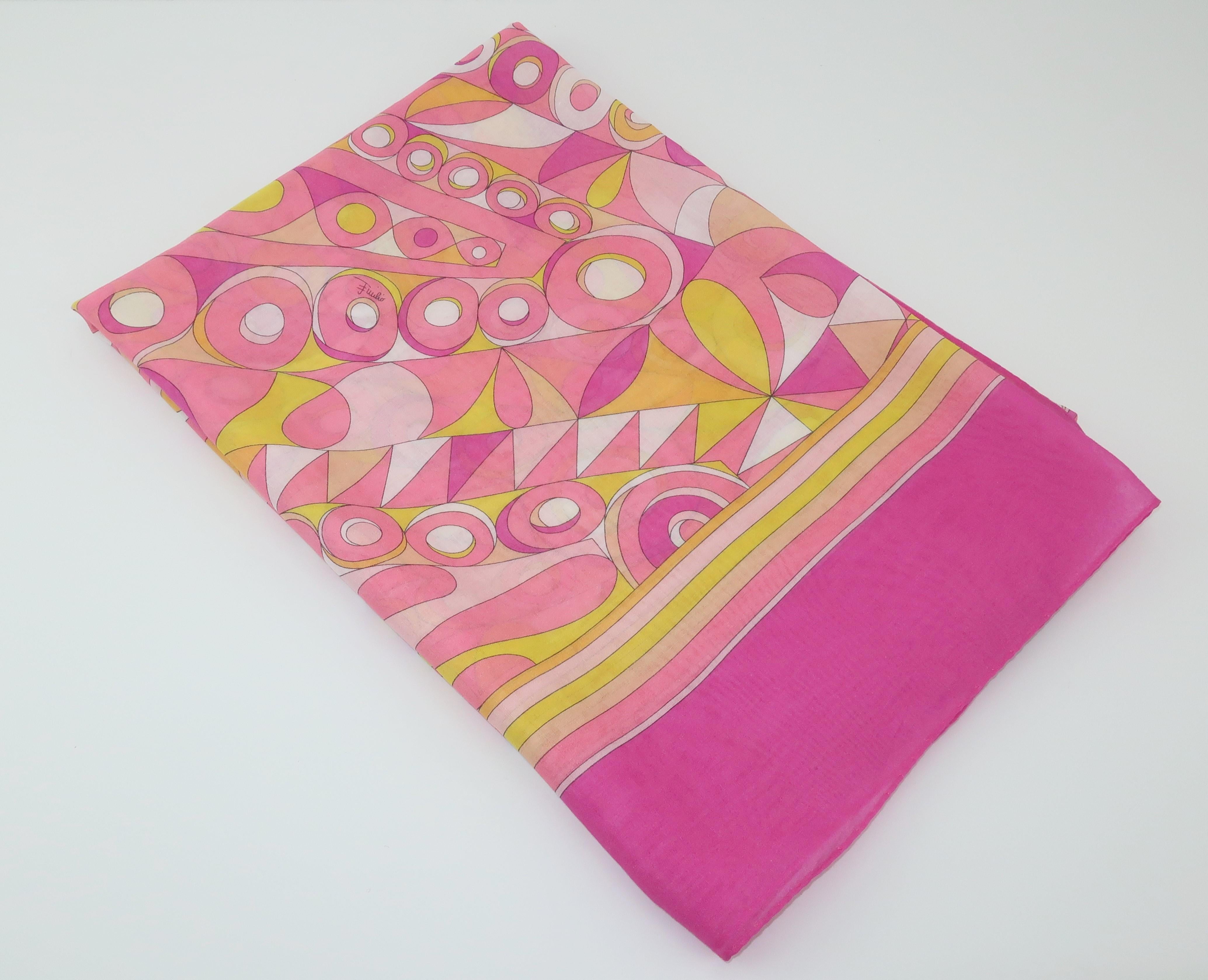 Perfect for warmer weather and sultry days at the beach! This fine muslin cotton Emilio Pucci scarf is both long and lightweight enough to wrap and drape to your heart's content. It is a classic mod psychedelic print in shades of hot pink, pale