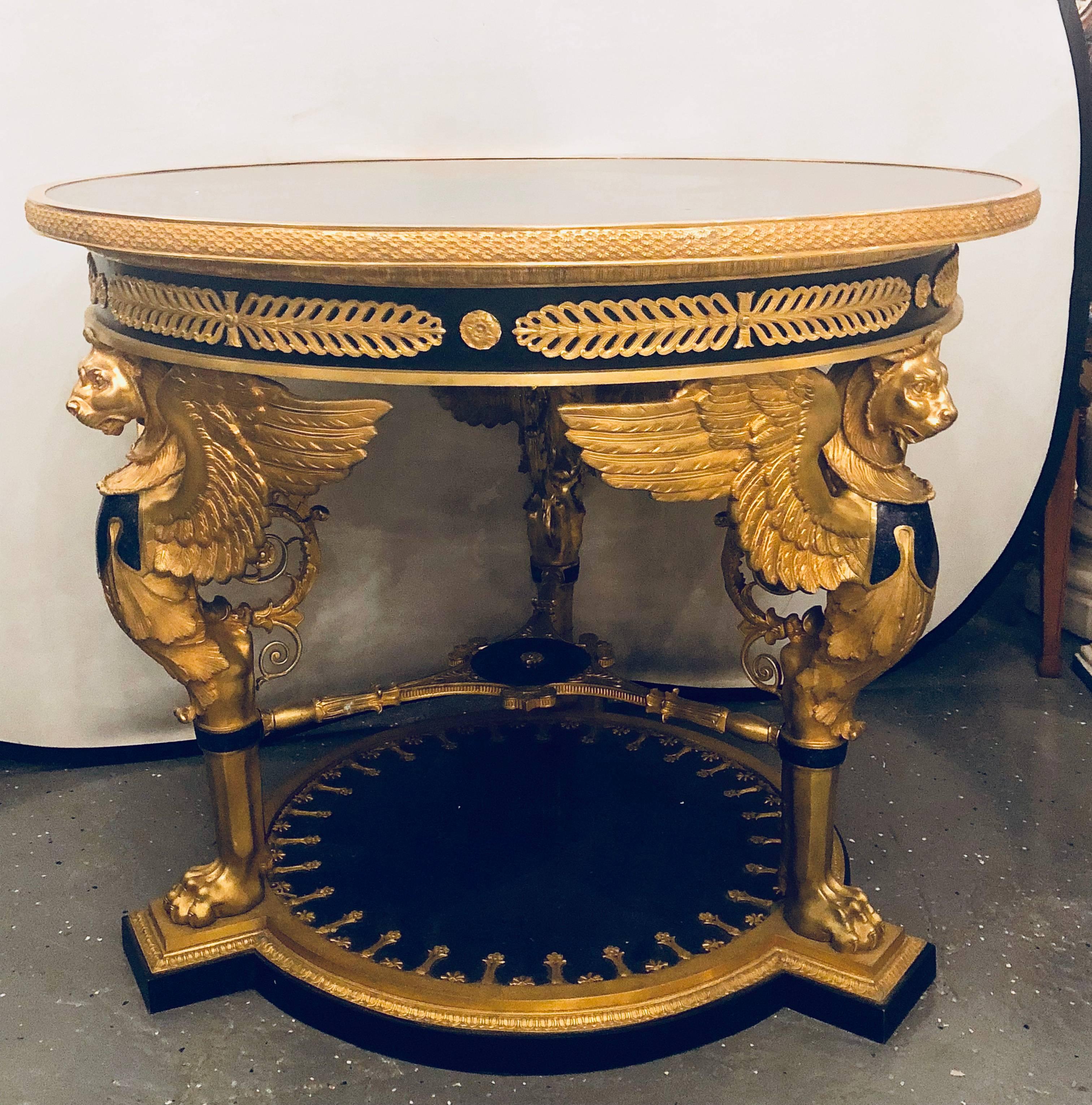 A large Empire style gilt and patinated Bronze and Lapis Lazuli centre table. Most likely Italian in very fine bronze chiselled detail. The full bodied gilt bronze and Lapis Lazuli winged lions supporting an exceptional tabletop. This fine piece is