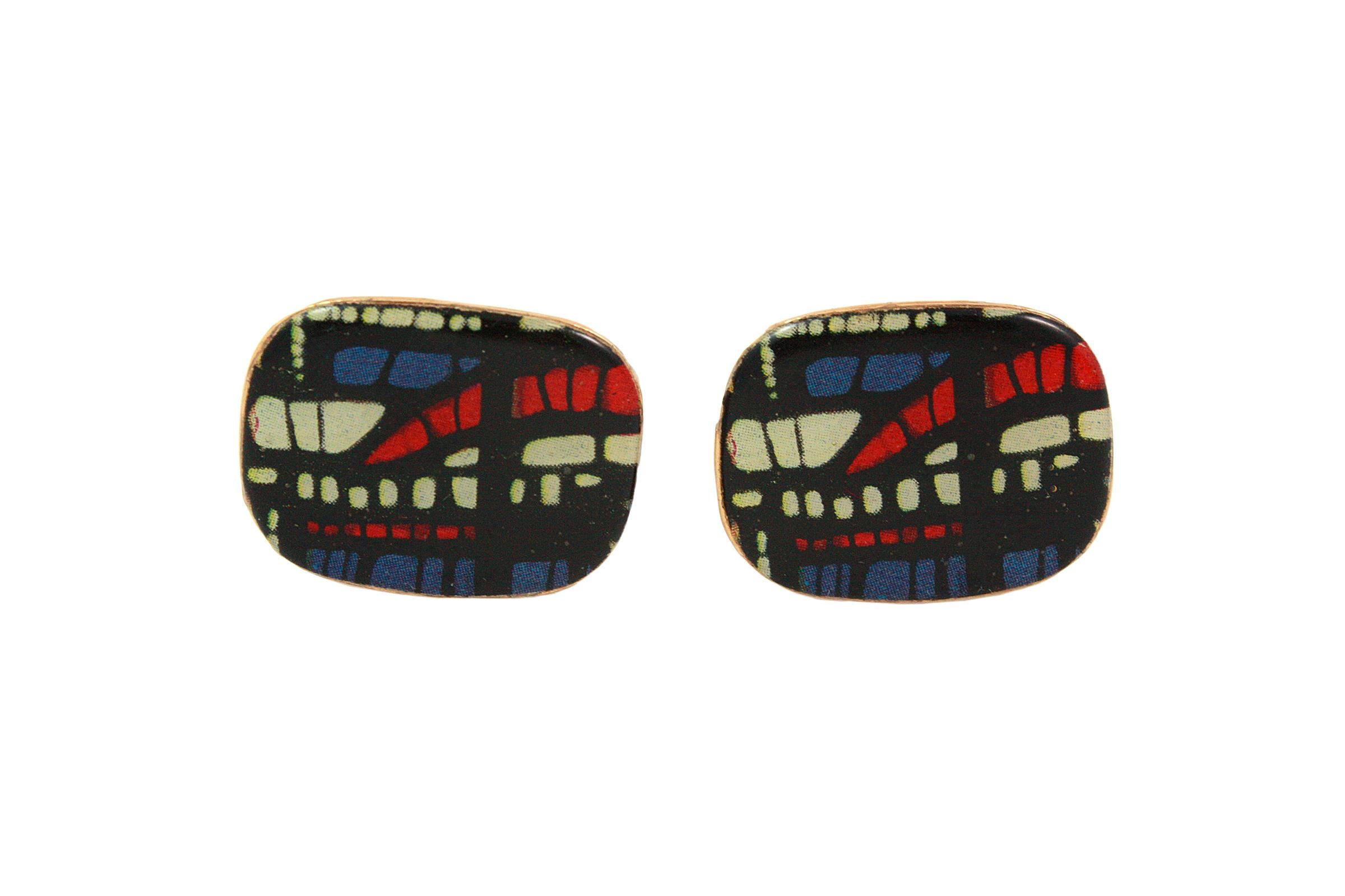 Curved rectangular gold tone gold vermeil over Silver cufflinks 
Black, white, red and blue pattern
Made in France 
Unknown designer
