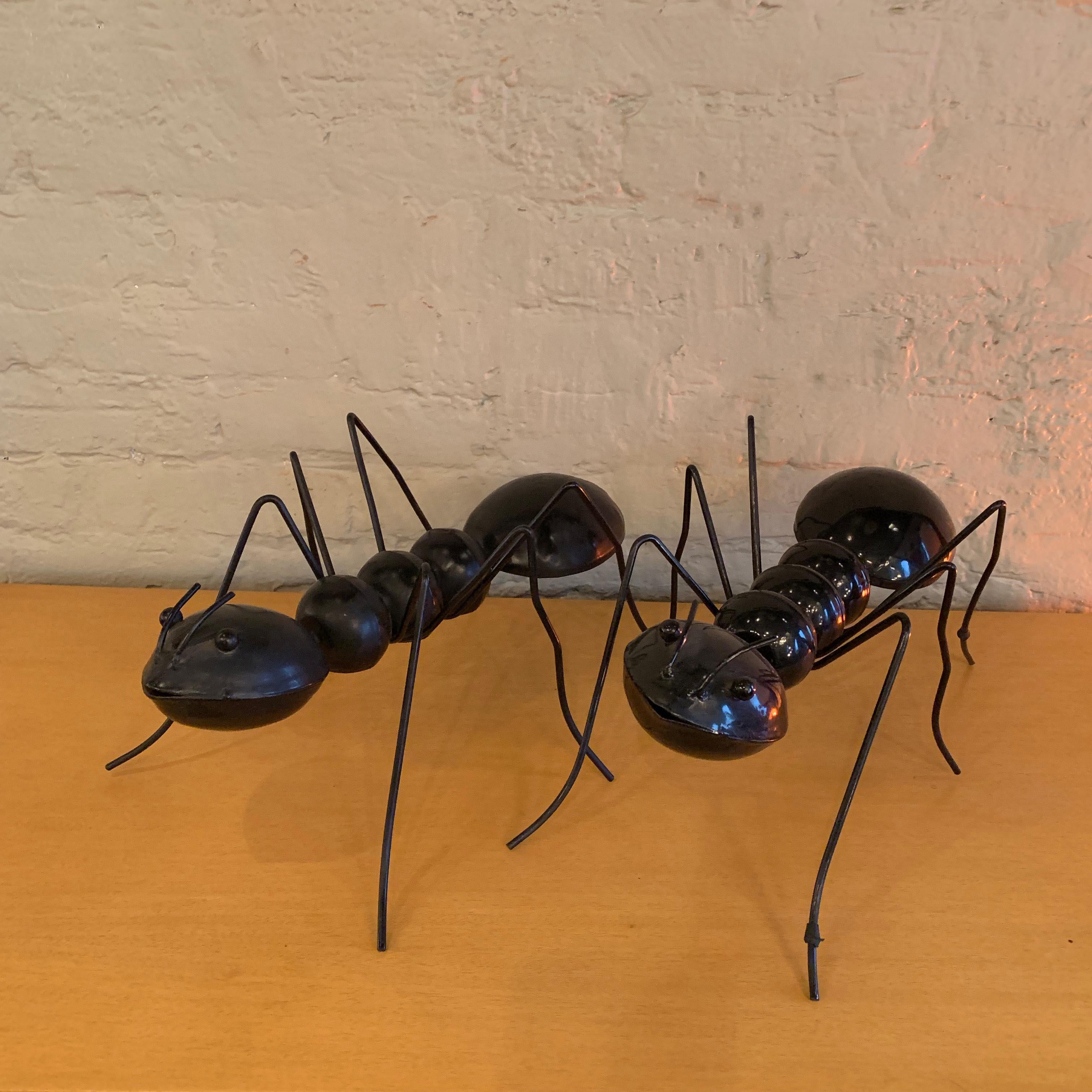 Interesting, enameled steel, ant sculptures are sold separately because they are slightly different; one with a shiny finish and the other a matt finish but they work well as a pair and get very lonely without each other.