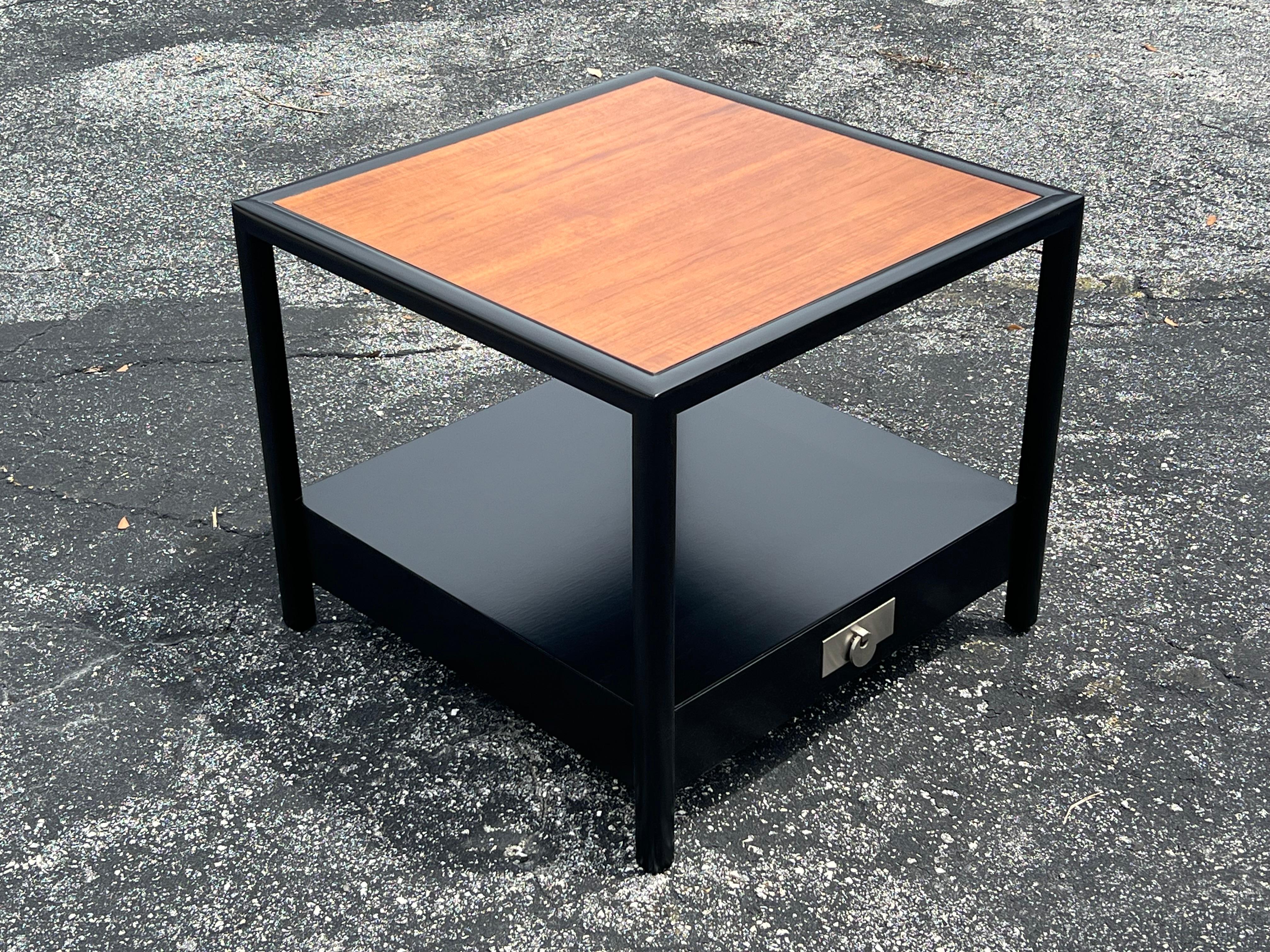 A classic end table or night stand by Michael Taylor for Baker, signed, ca' 1950's. From the New World Collection by Baker Furniture. Single drawer with open space on top, two tone finish, newly redone. 