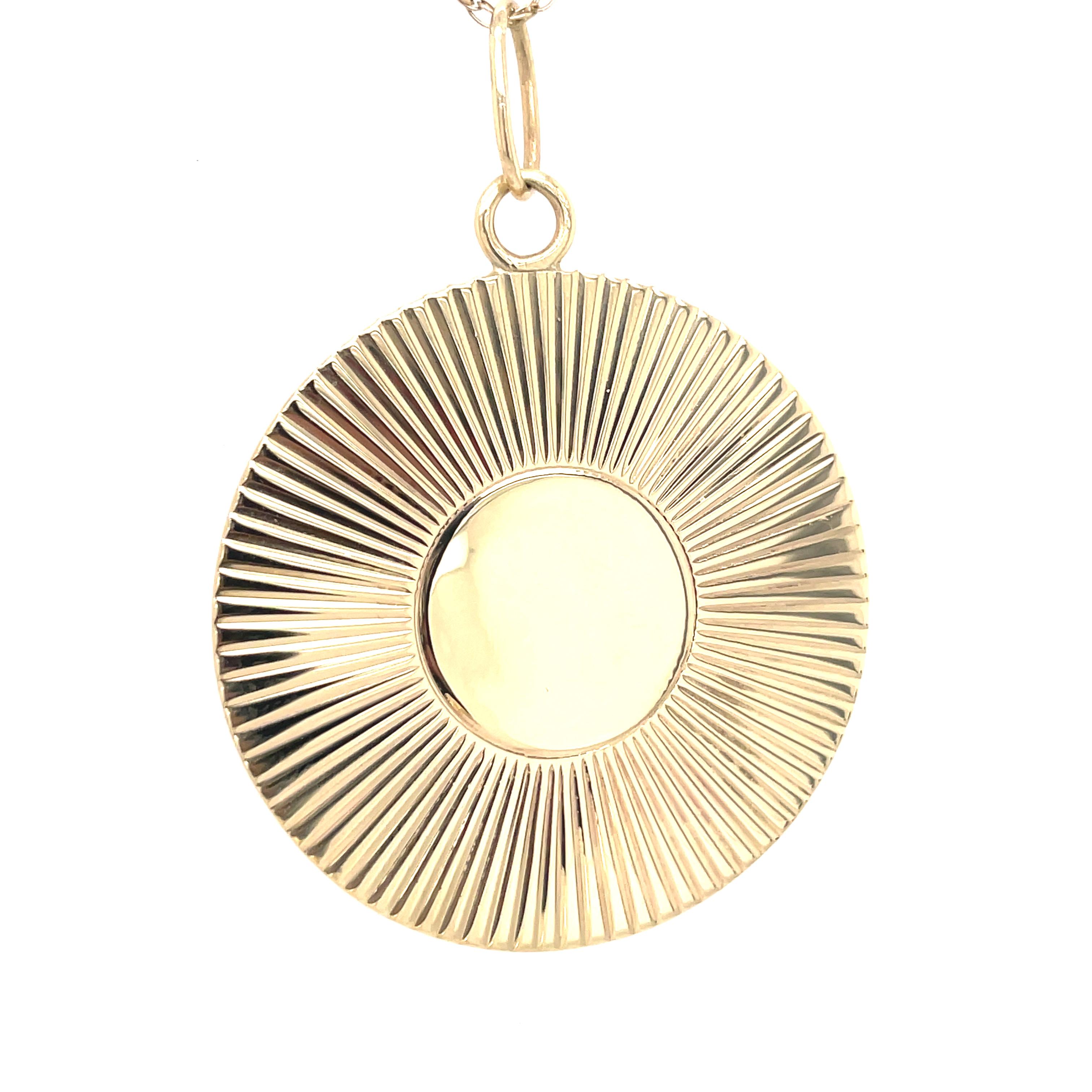 Very large round pendant/medallion/charm. Solid gauge 14K yellow gold. There is a fine-line pattern around the border.  The center reserve and the reverse side have never been engraved.  You can personalize by adding a hand-engraved monogram, date,