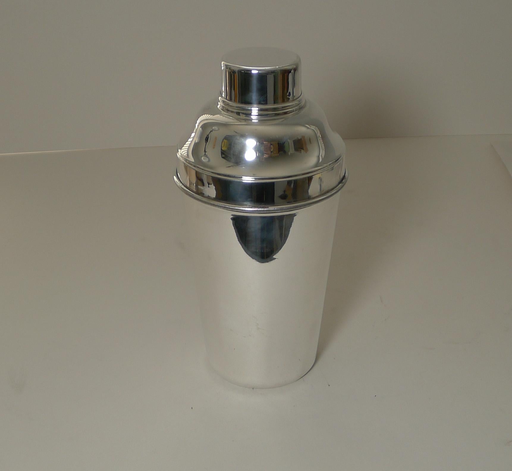 A large Art Deco cocktail shaker in silver plate just having returned from our silversmith having been professionally cleaned and polished.

The underside is fully marked for P H Vogel & Co. / EPNS (electro-plated nickel silver) and 