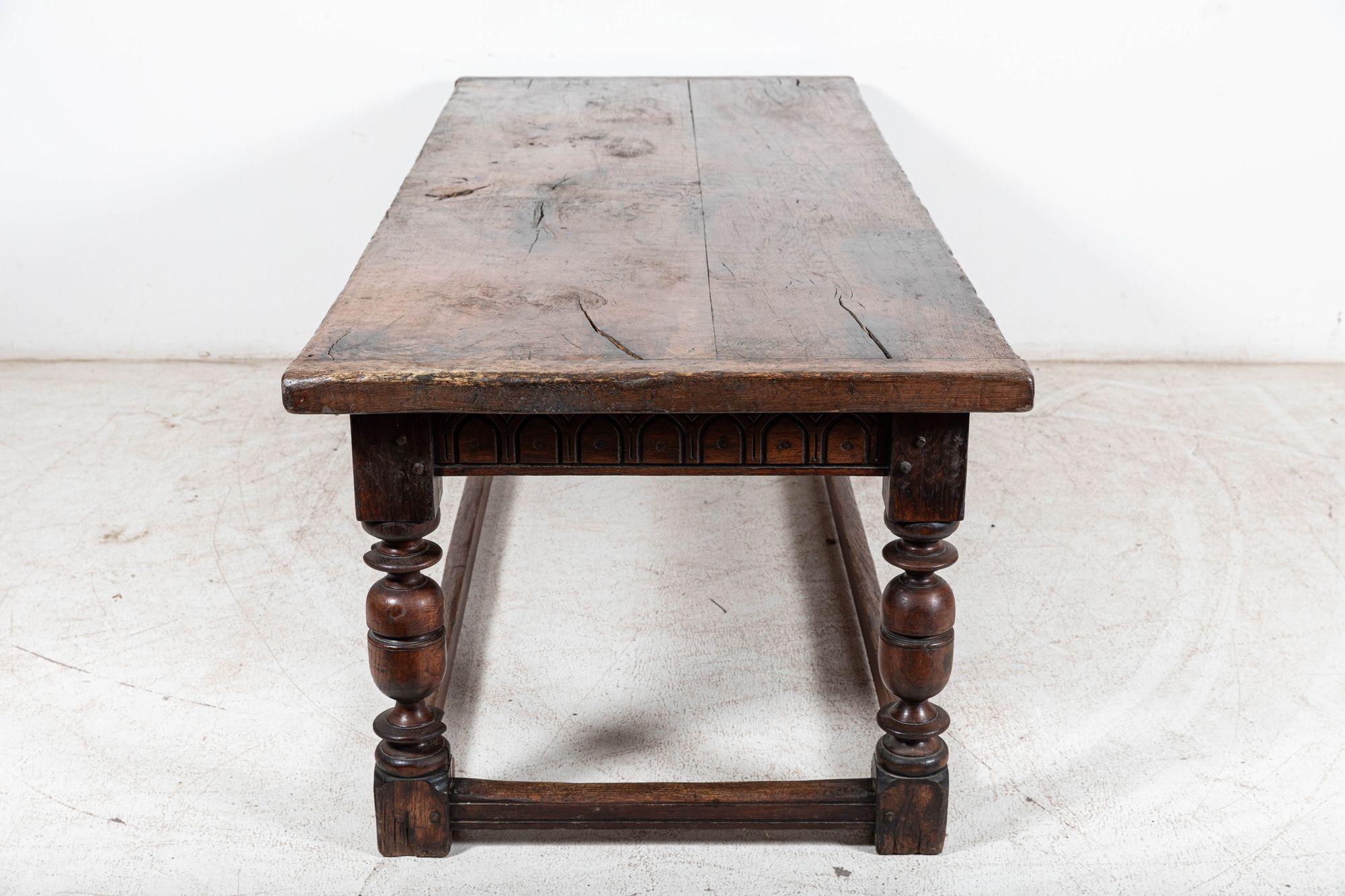 Circa 1690

Large English 17thC Elm & Oak Refectory Table with 2 Plank Elm and cleated top of lovely colour and rich patination over carved frieze rails.

Supported on substantial well turned baluster oak legs with stretchers. Removable 5cm thick