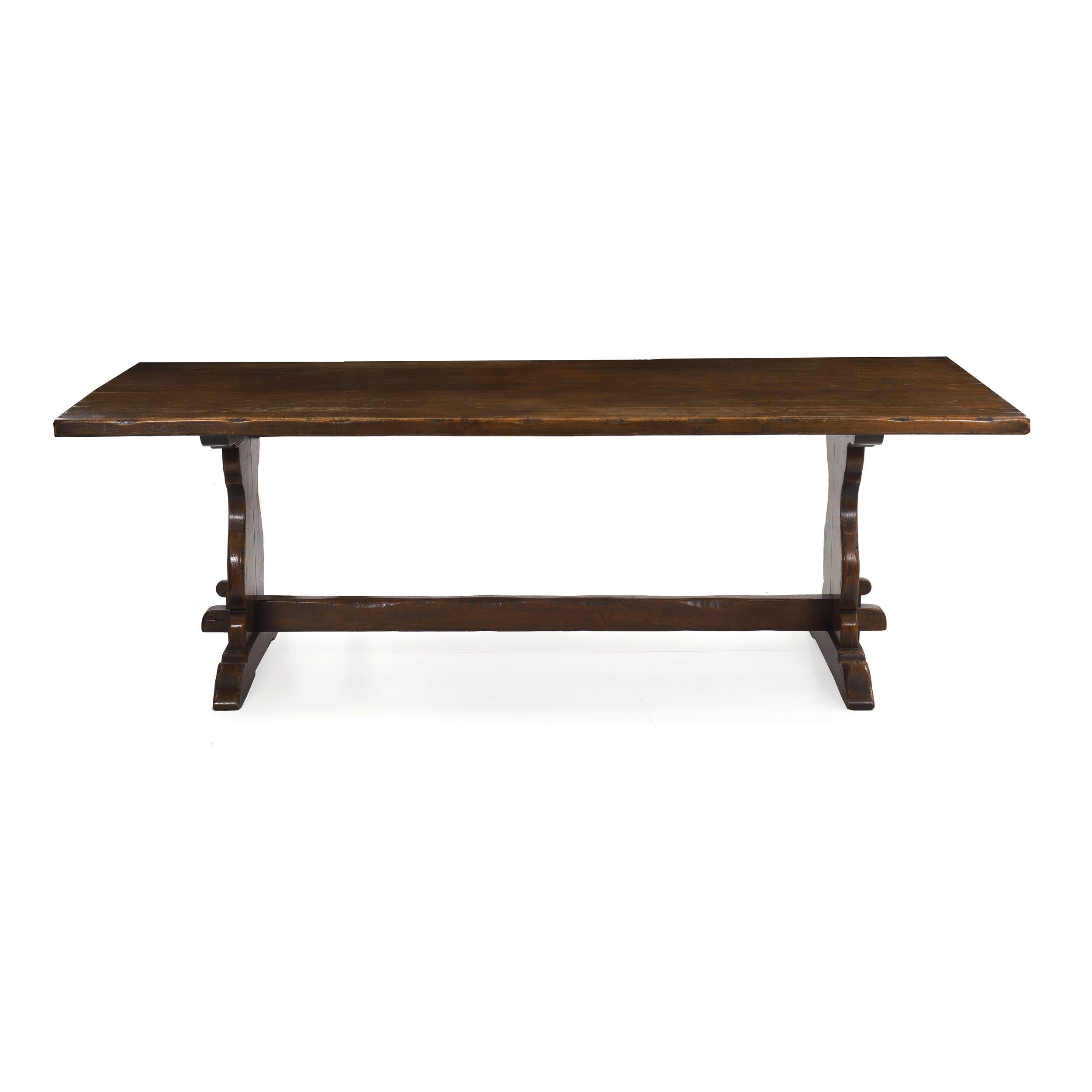 A heavy and incredibly well built refectory dining table, it is crafted with careful period techniques with huge solid golden oak planks utilized for every element. The top is a carefully joined set of five planks that are nearly invisibly brought
