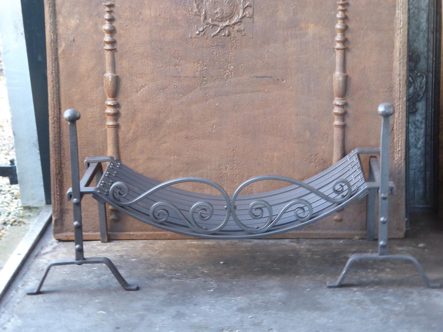 Beautifully forged English Art Nouveau fireplace basket or fire basket. The fireplace grate is made of wrought iron.

This product has to be shipped as freight due to its size and/or (volumetric) weight. You can contact us to find out the daily rate