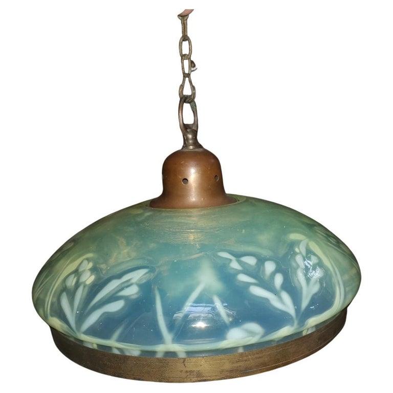 Large English Arts & Crafts Vaseline ceiling light with floral details, a brass rim to the edge & a brass hanger.

