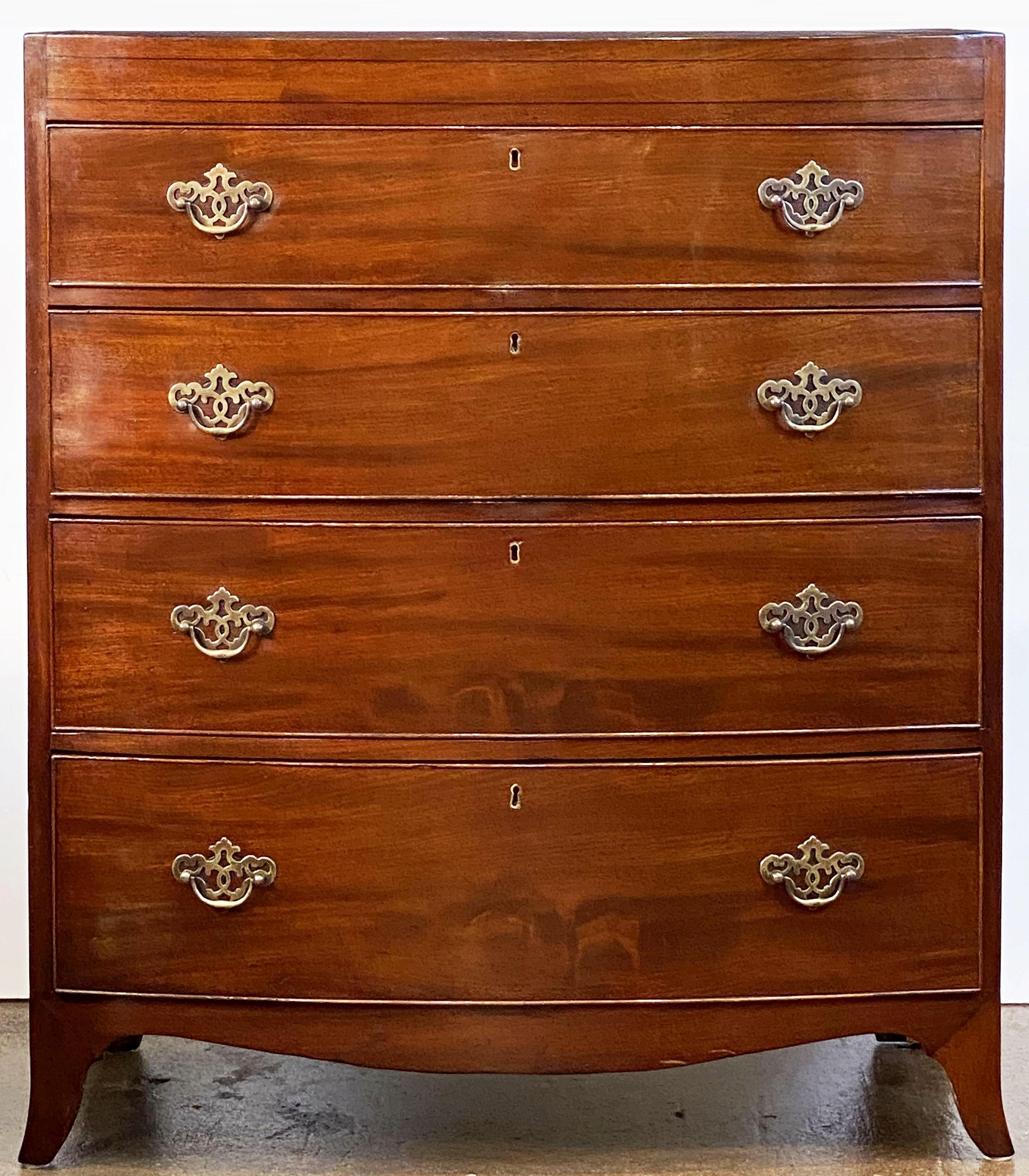 A fine English bow-front chest of mahogany featuring a bowed top over four beaded drawers with brass pulls, and set upon an apron base with splay feet.
 