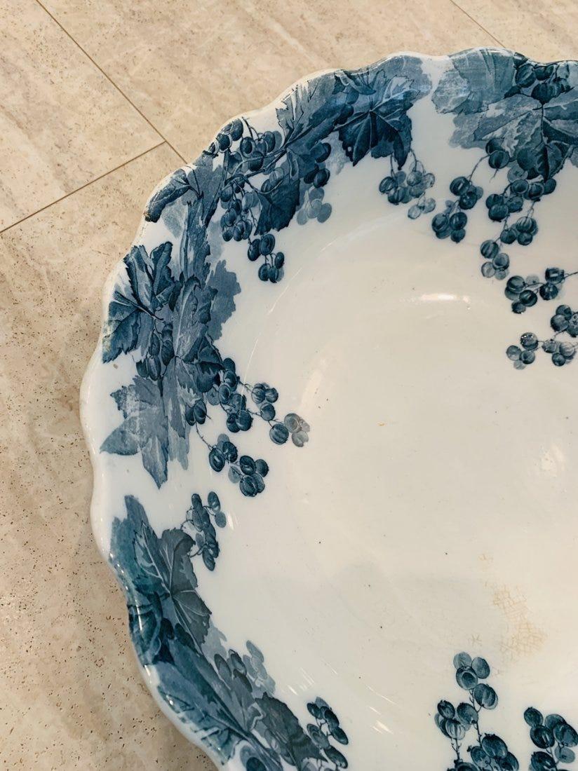 Large bowl made in England by Ridgways and part of the Zenda collection.

The piece has beautiful foliage that is hand painted and scalloped edges.The piece has no chips or losses however there is some crackling to the surface with some dust