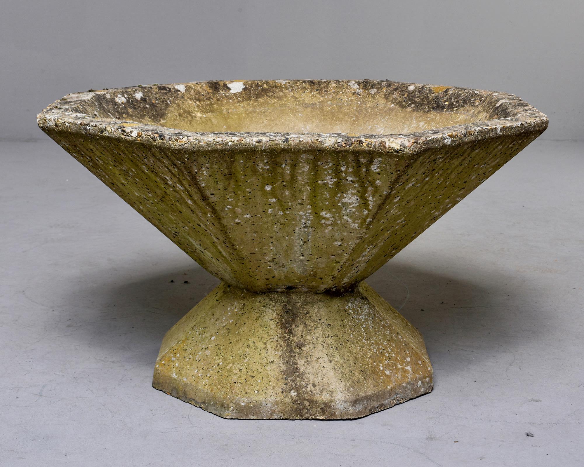 English stone planter in form of flared, eight-sided bowl on a base, circa 1910. At the time of this posting, we have three total and two are connected at the base and one is not. Age related patina, moss. Unknown maker. Sold and priced individually.