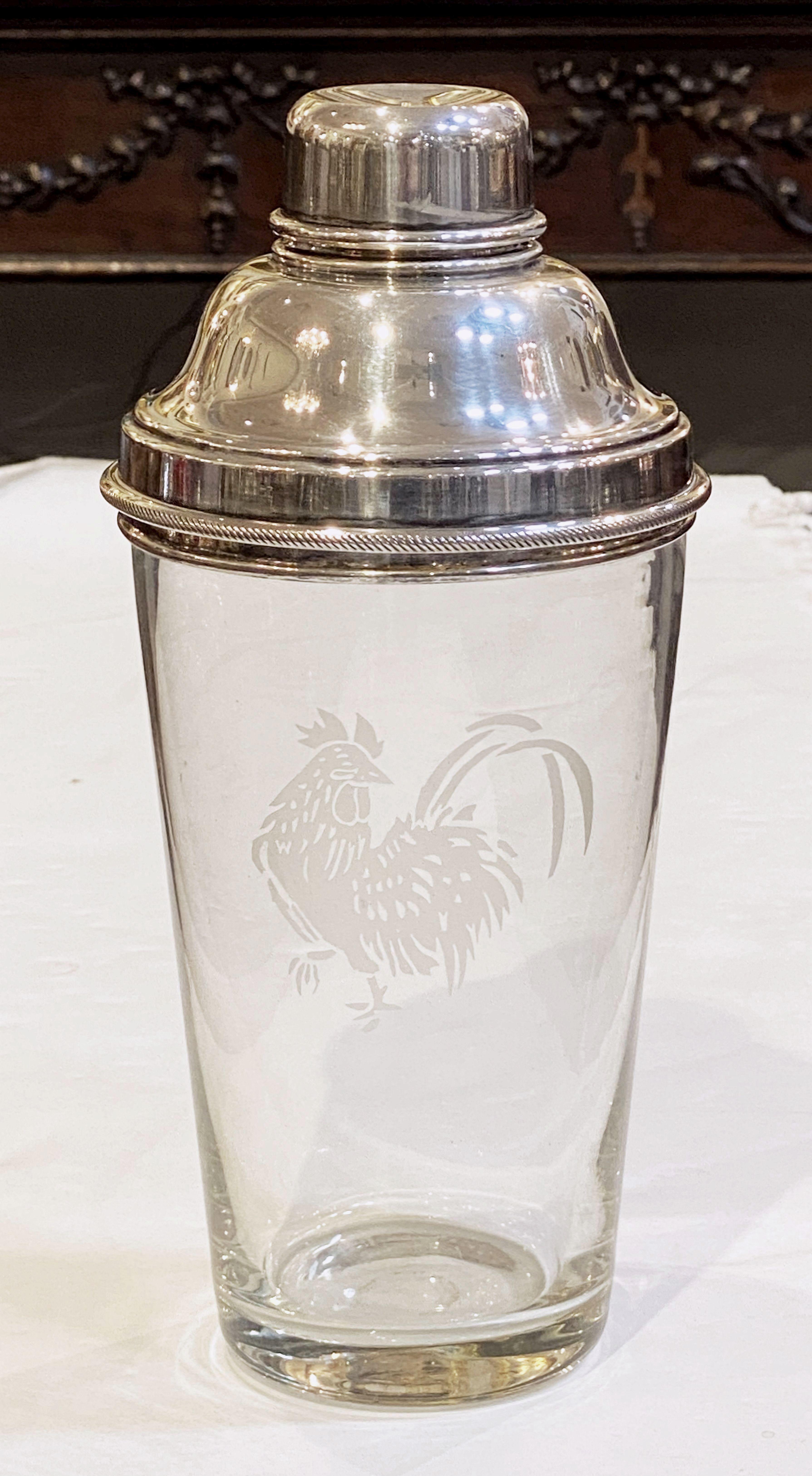 A large vintage English cocktail drinks or martini shaker of glass with removable cap and strainer of fine plate silver, 1 1/2 pints, featuring an etched cockerel on a cylindrical body.

Perfect for the bar. Even better for martinis.