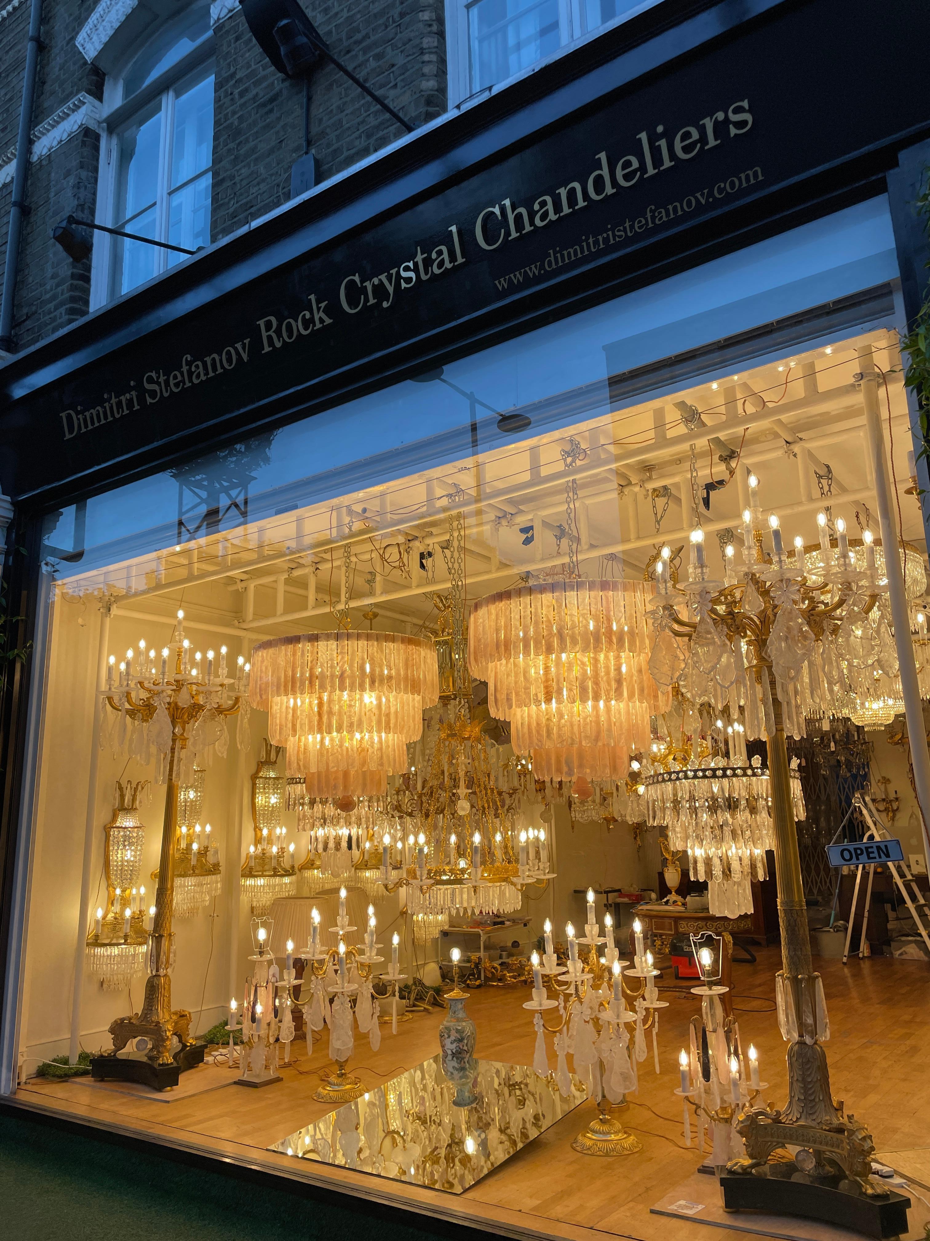 A beautiful and large English crystal chandelier with 25 lights.  A double tier configuration of 12 lower and 12 upper arms staggered around the chandelier giving a pleasing look, with each arm terminating in a clear crystal  in which sits a bulb.