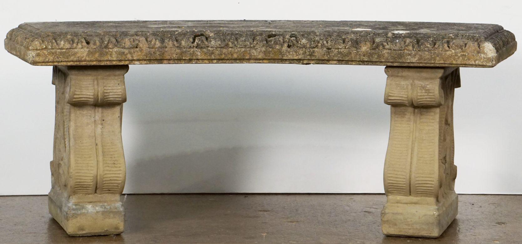 A fine large English garden bench or seat of composition stone, featuring a curved top ( inches length), set upon two plinth supports with a scroll design.

Note: The depth of the curved seat is 16 inches - the overall depth from back to front