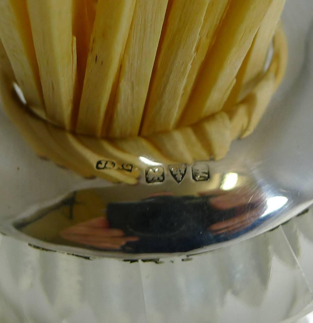 A stunning large and heavy cut crystal table-top match strike topped with English sterling silver.

The strike is beautifully cut with a honeycomb design to the bottom section and a finely cut band for striking non-safety matches. I have displayed