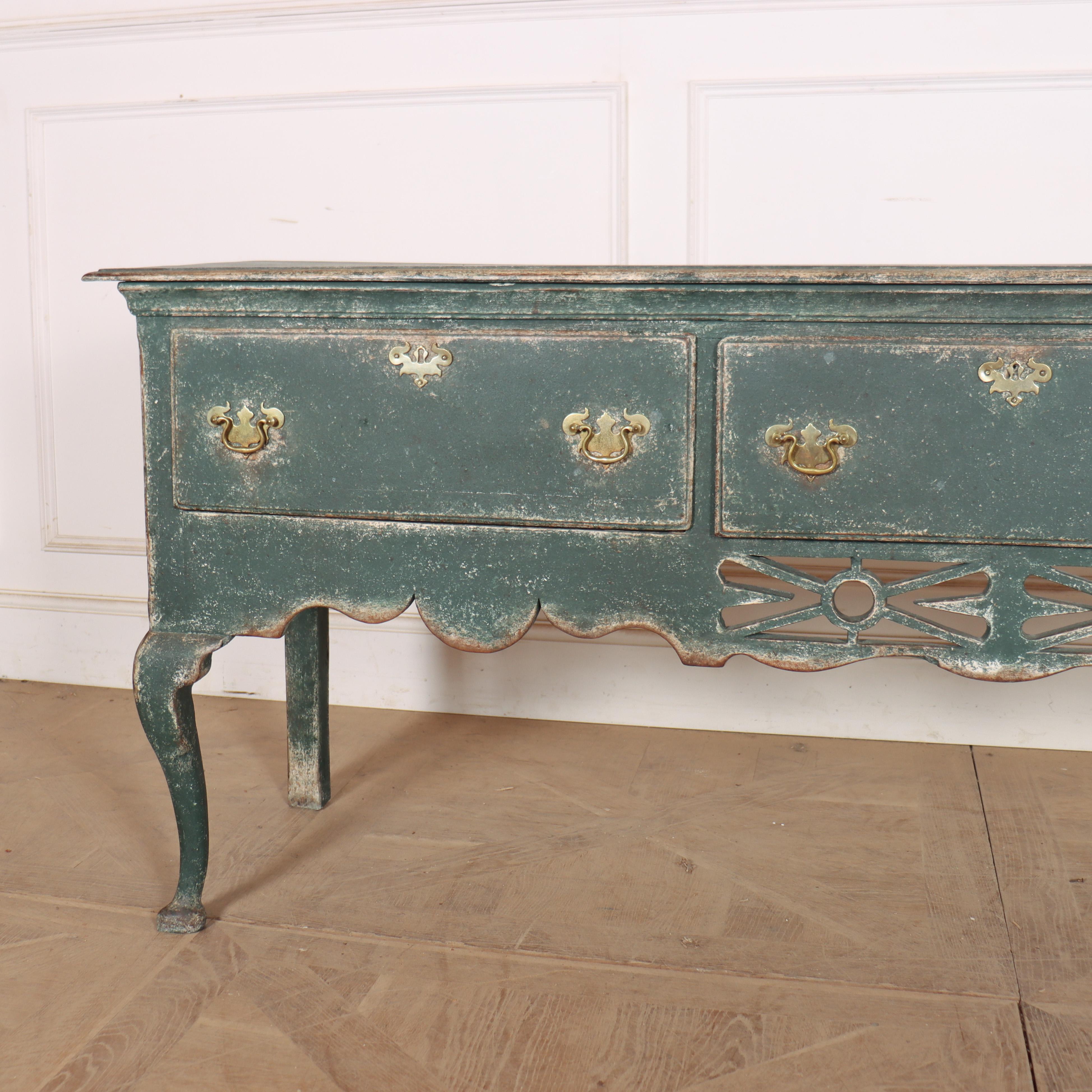 Large 18th century English three drawer cabriole leg oak dresser base with fretted frieze. 1750.


Code: 8931

Dimensions:
W: 76.5