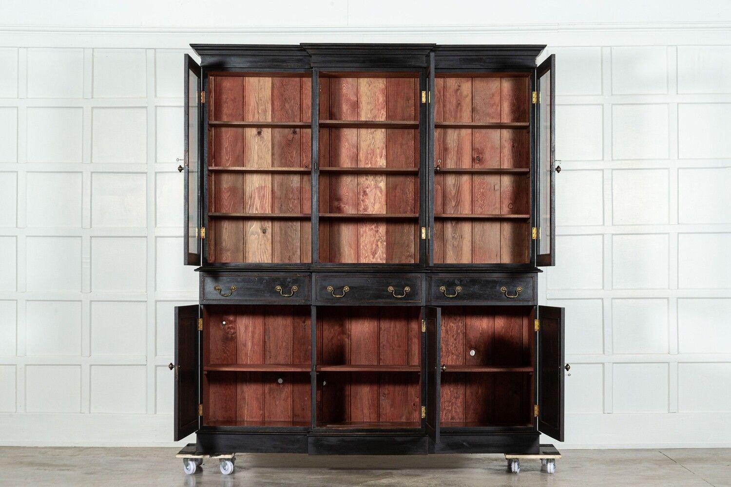 circa 1940
Large English Ebonised Mahogany Glazed Breakfront Bookcase
sku 1040
Base W189 x D41 x H102 cm
Top W197 x D34 x H122 cm
Together W197 x D41 x H224 cm
Weight 166 Kg