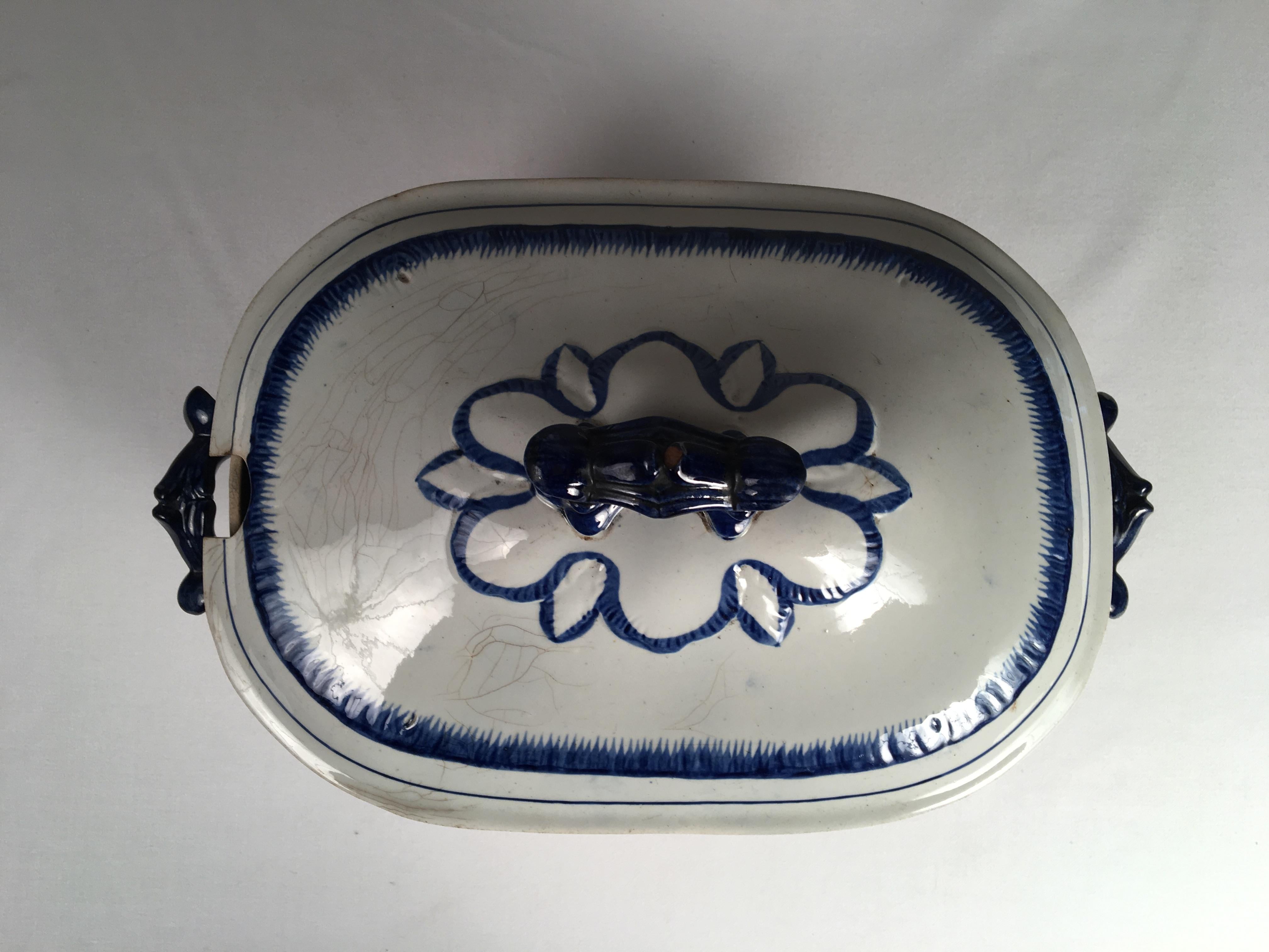 A large blue and white featherware soup tureen, probably Leeds, with lid and handles, circa 1840.