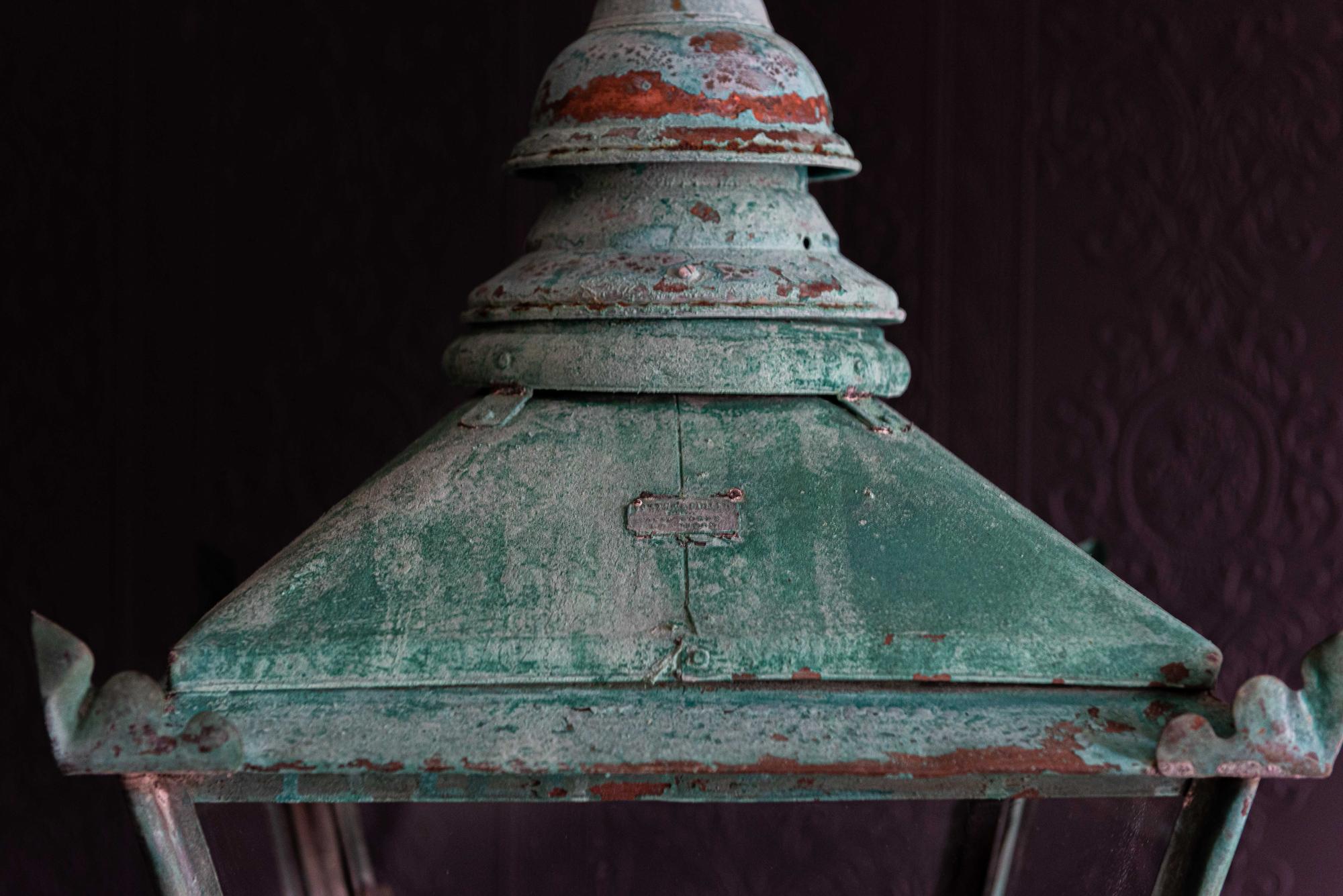 Large English Foster & Pullen Verdigris copper lantern
circa 1870.

With screw fit top and hinged front door, 'Foster & Pullen Bradford' name plate in place.

Comes with 1m of silk flex, 1m of heavy gauge antique brass chain and bronze ceiling