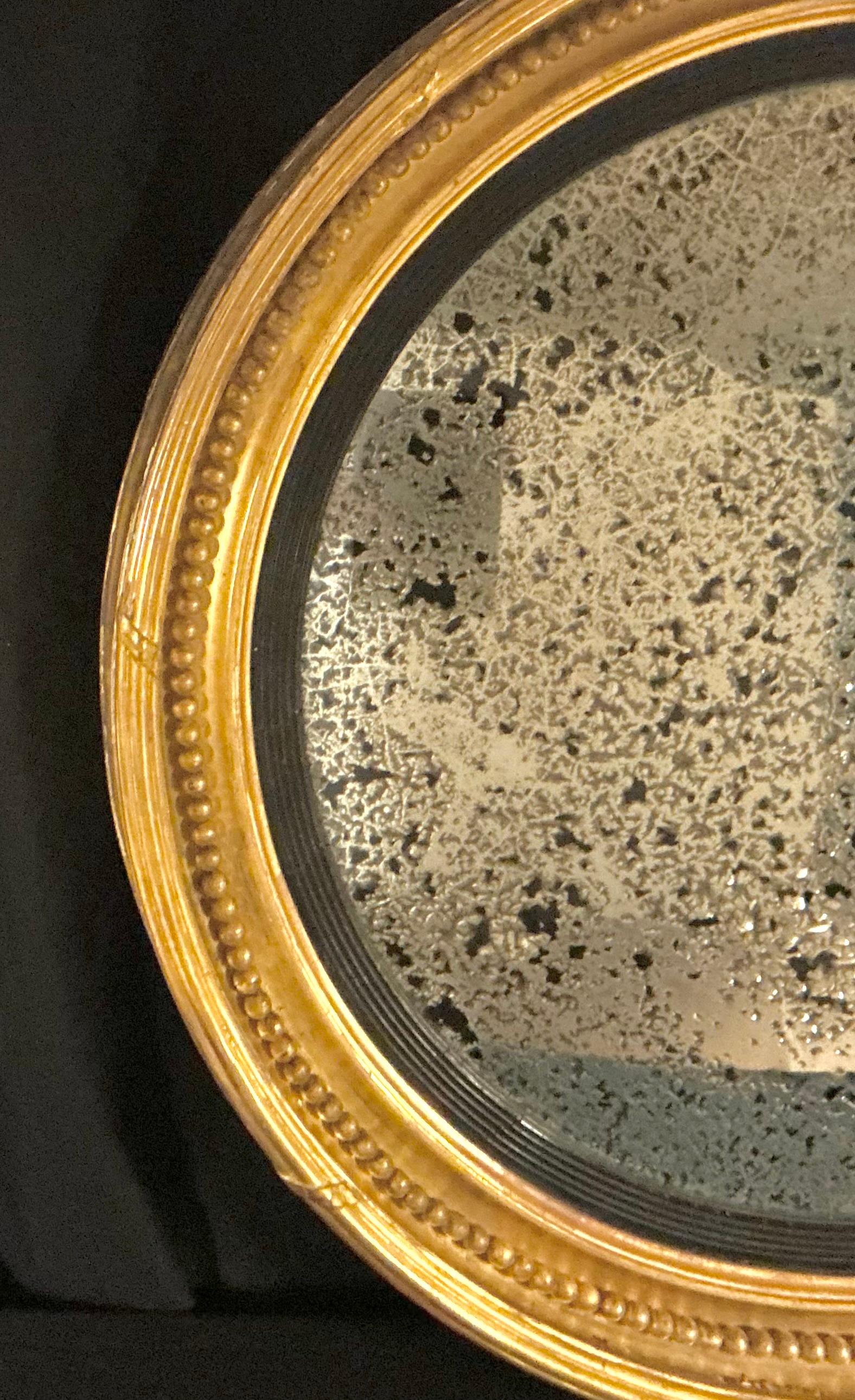 Regency Grand miroir convexe à œil de bœuf en bois doré anglais, par Charles Nosotti en vente