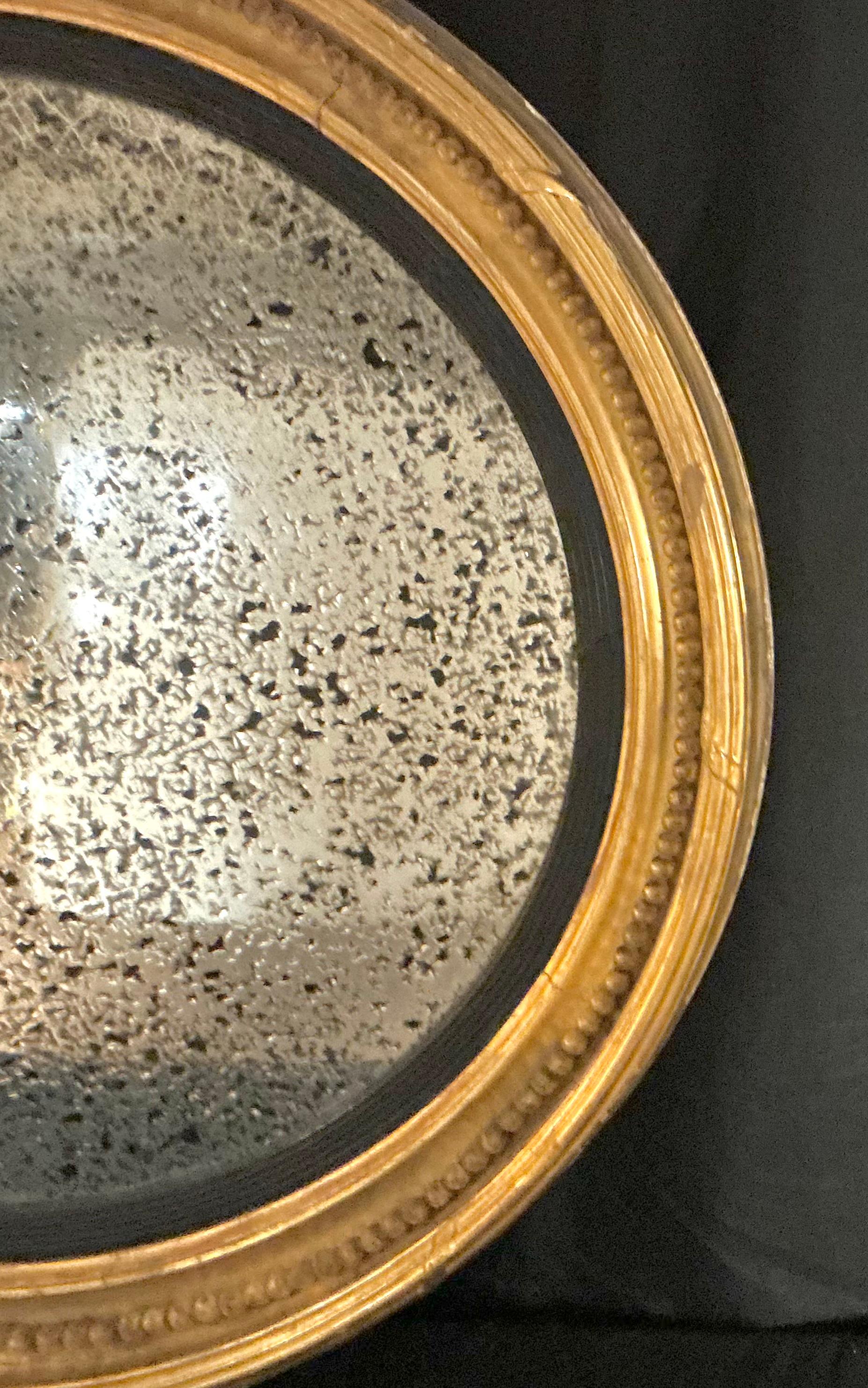 Britannique Grand miroir convexe à œil de bœuf en bois doré anglais, par Charles Nosotti en vente