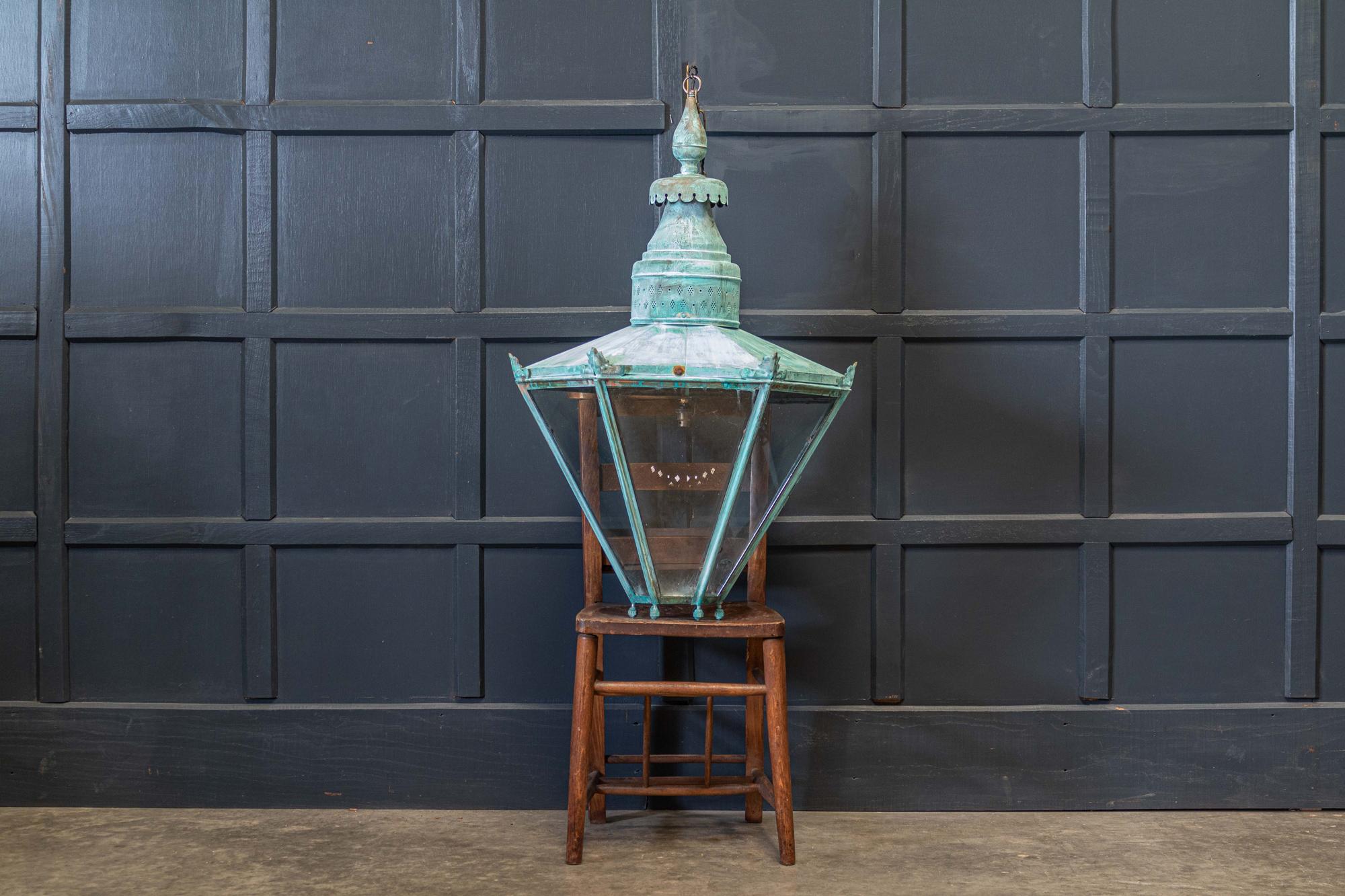Circa 1950's

Large English Hexagonal Verdigris Lantern

Glazed hinged door with excellent decorative colour, comes with 1m of silk flex, 1m of heavy gauge antique brass chain & bronze ceiling hook.

Glazed rewired & pat tested - ready to