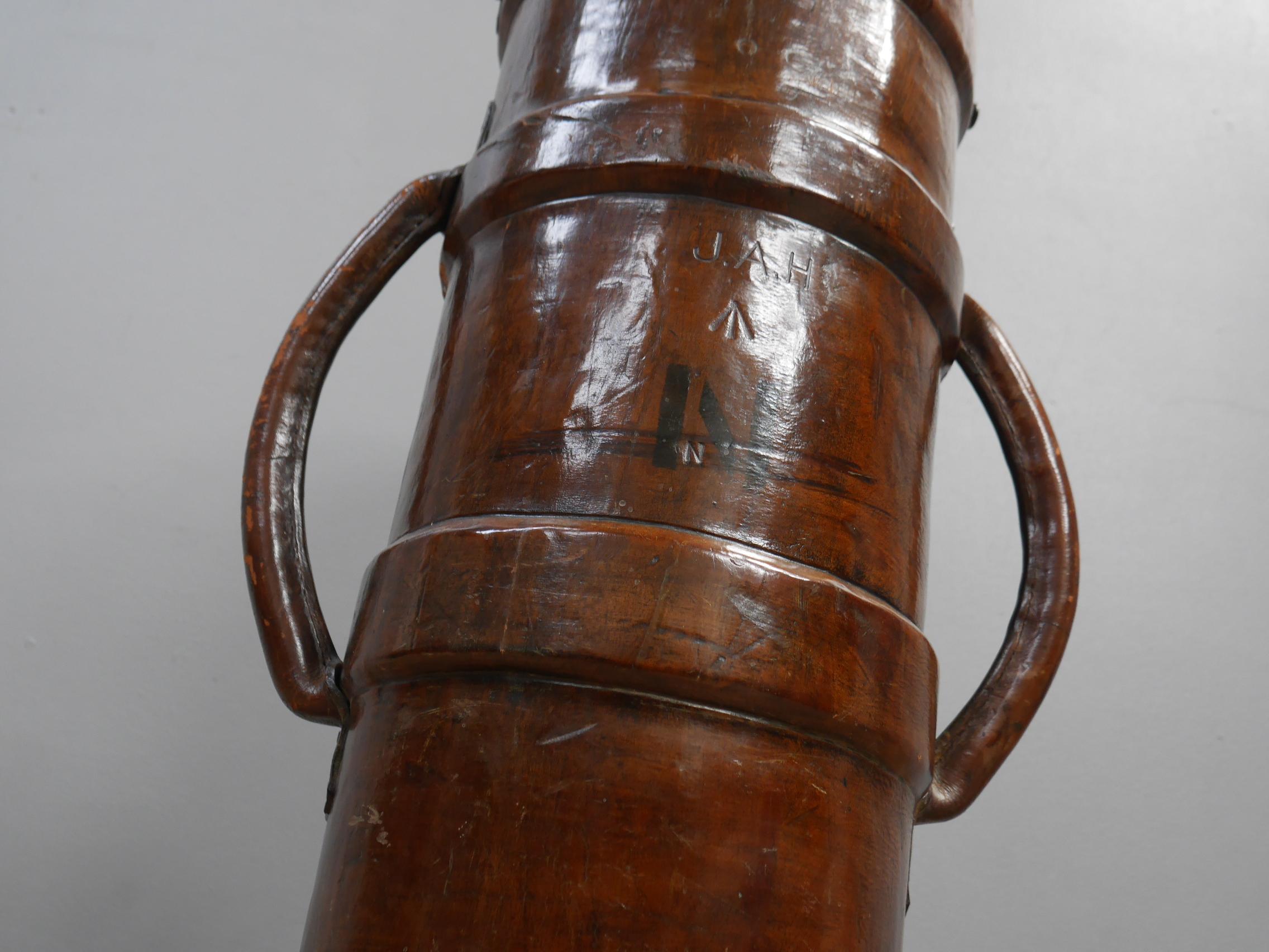 A large English leather Naval Cordite carrier.
A superb example & a scarce model of excellent scale, delightfully untouched & in leather covered cork with twin handles & brass riveting. 
These 'flash-proof' buckets were used by the Navy & Military