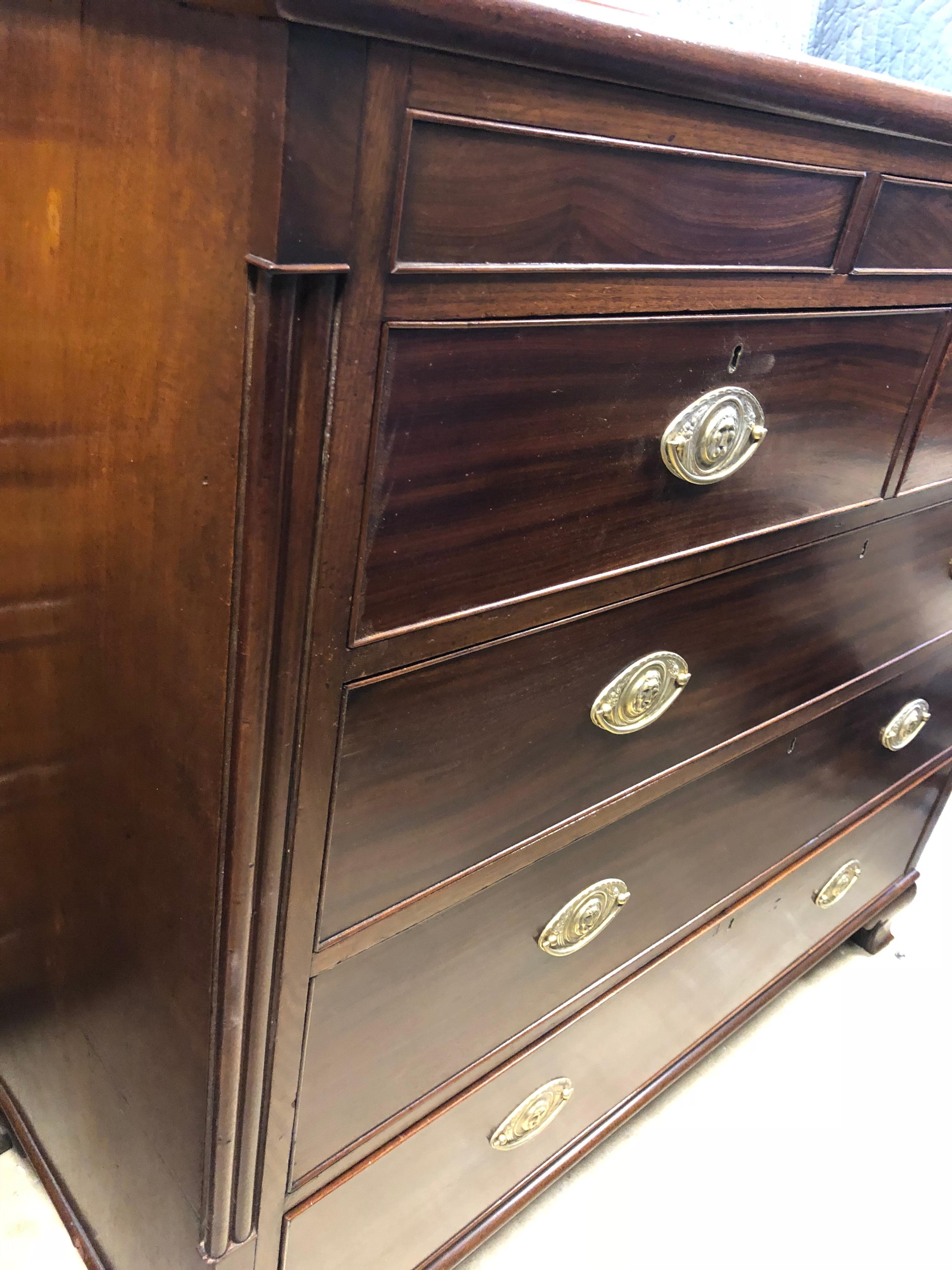 Large English Regency chest, circa 1820, mahogany with 3 small drawers across the top, only the middle one opens from inside and the other 2 are false, beautiful color, deep, heavy drawers, replacement solid brass pulls, nice shaped bracket feet,