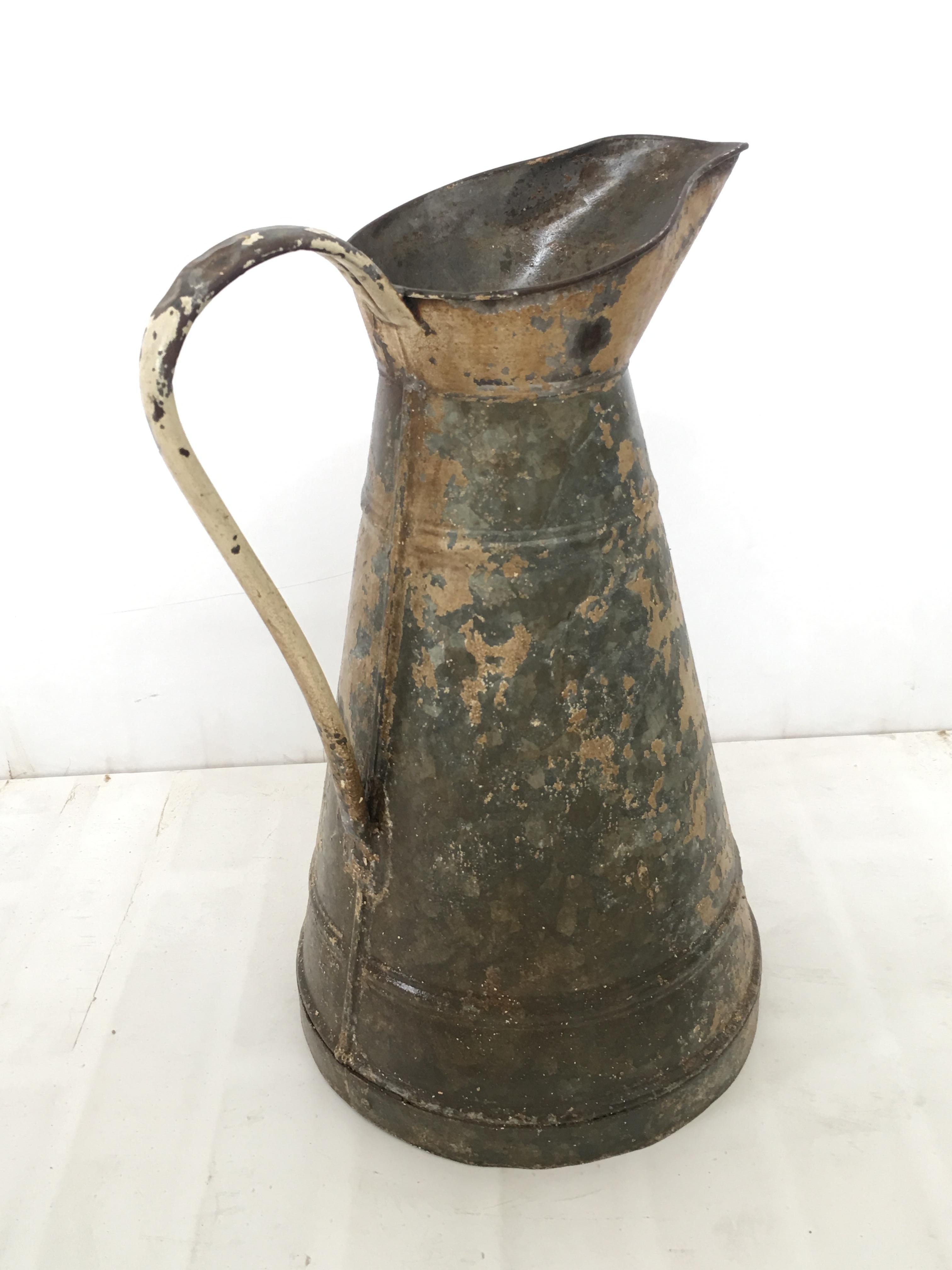 Large English metal pitcher, late 19th century.
A handsome early 20th century copper jug with a distinctive patina surface decoration.
The large pitcher displays well with a lovely, old patina complimenting a sleek, tapering shape with