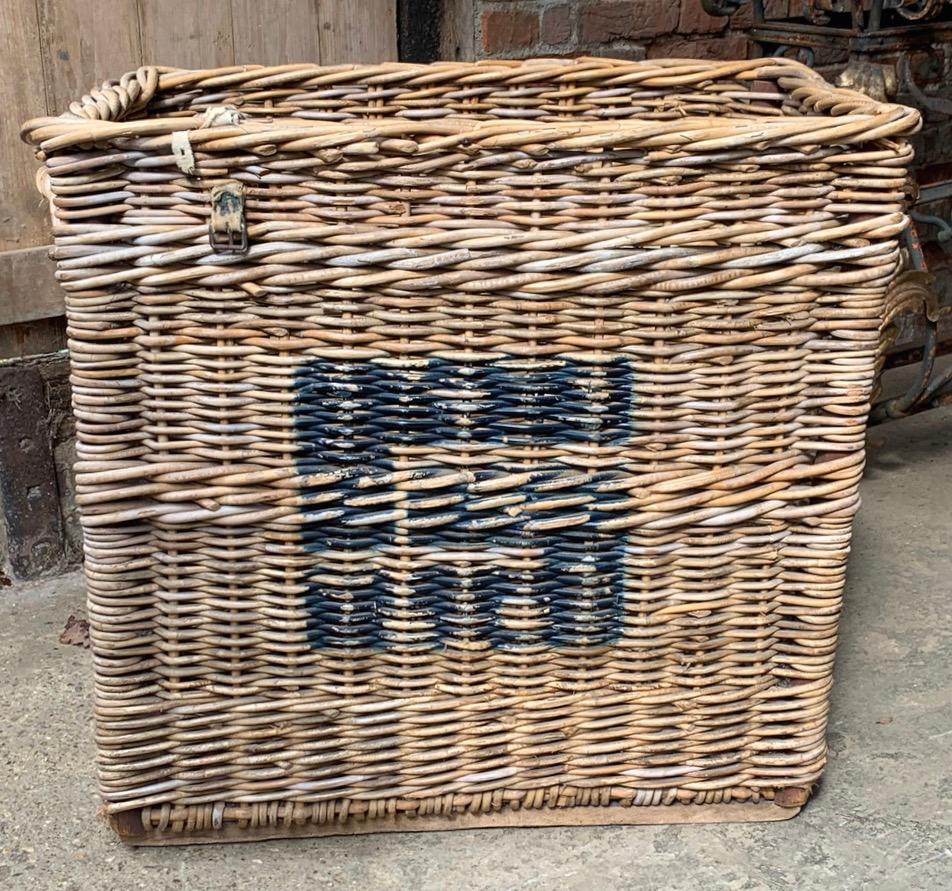 A lovely old English mill basket dating to the early 20th century. In good original condition with the original painted markings of the mill. This will now make a lovely log or storage basket.