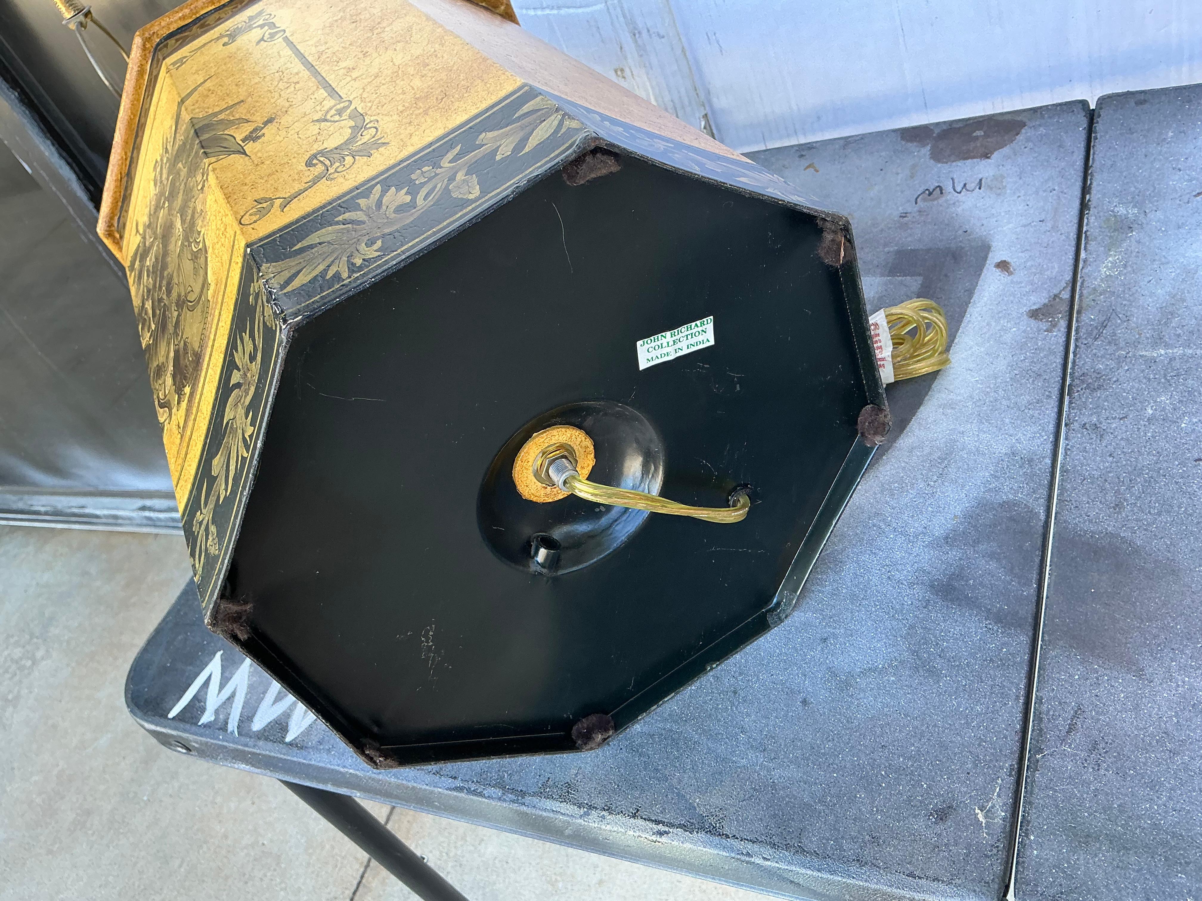 This is an offering for a pair of large scale tole  tea canister style table lamps designed by John Richard. They have wonderful, vibrant colors with the dominant being a distressed mustard. The other colors are black and gilt. They are marked and