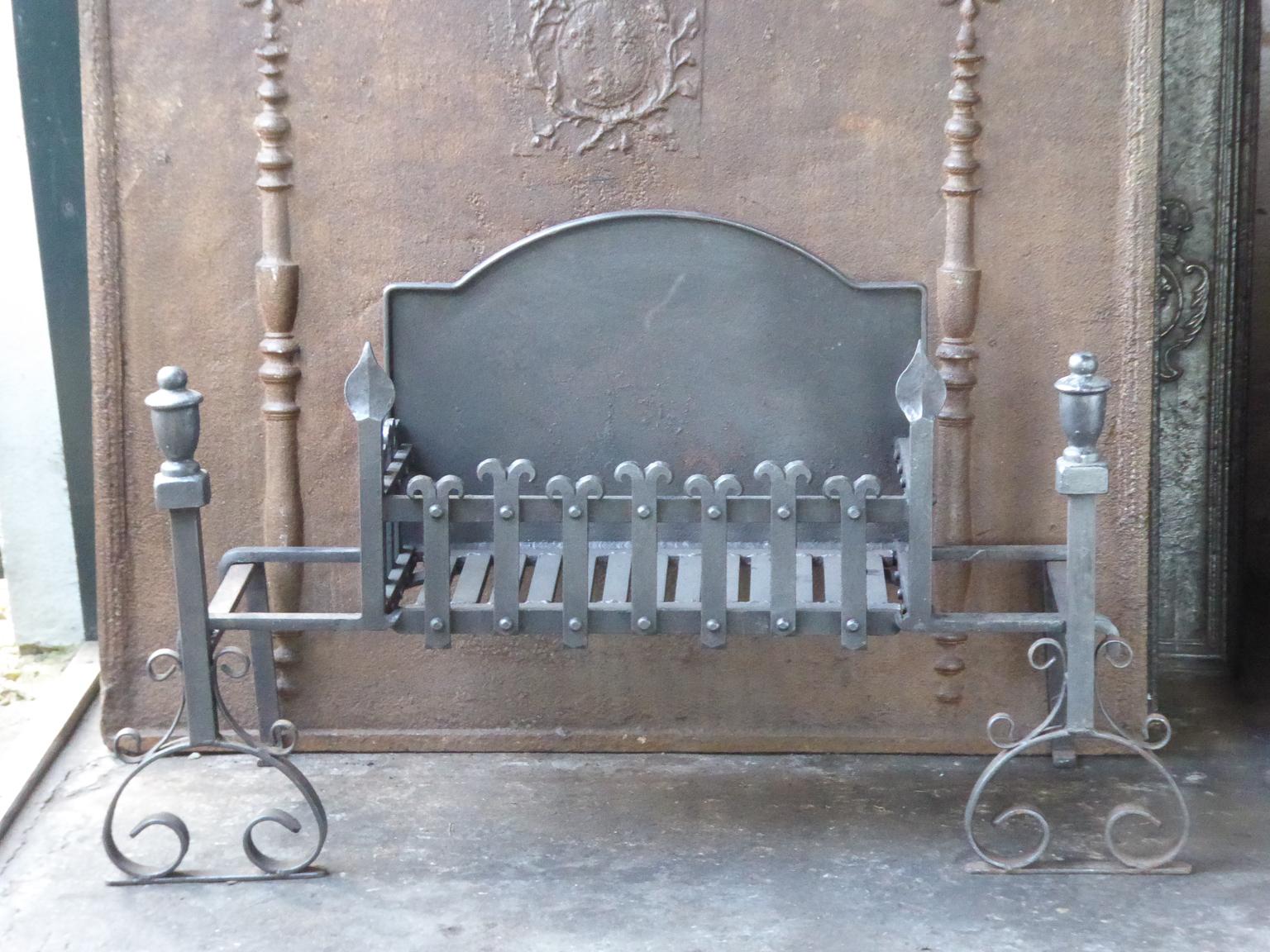English Neo Gothic fireplace basket or fire basket. The fireplace grate is made of wrought iron and cast iron. The total width of the front of the grate is 41 inch (104 cm).







 







 

 