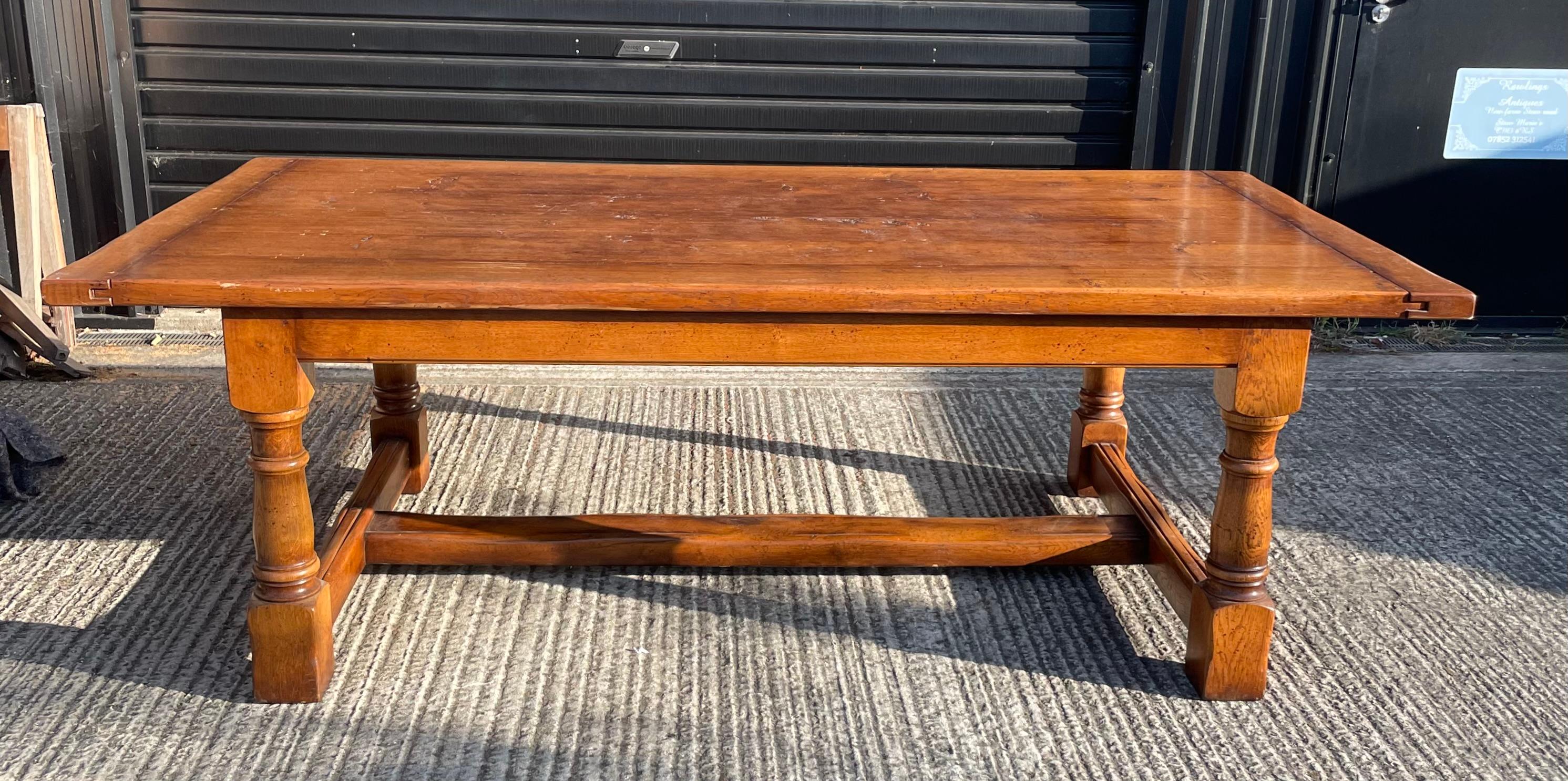 Very good quality large vintage solid English oak farm house refectory table .
The table has a 6 plank solid oak top that has been traditionally peg jointed and is 1 3/4 inches thick 90 inches long and 47 inches wide that will seat 8 people with