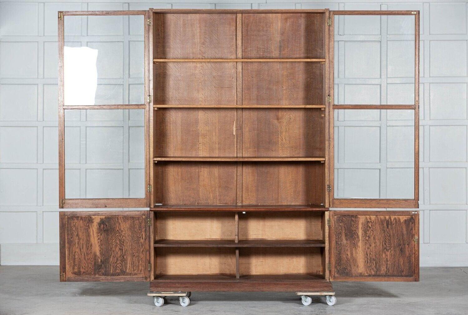 circa 1890
Large English oak glazed bookcase cabinet with adjustable top cabinet shelves.
Provenance: London Art School - Kennington.
Measures: W 149 x D 37 x H 220cm.
Base W 140 x D 37 x H 65cm.
Top W 138 x D 34 x H 155.
 